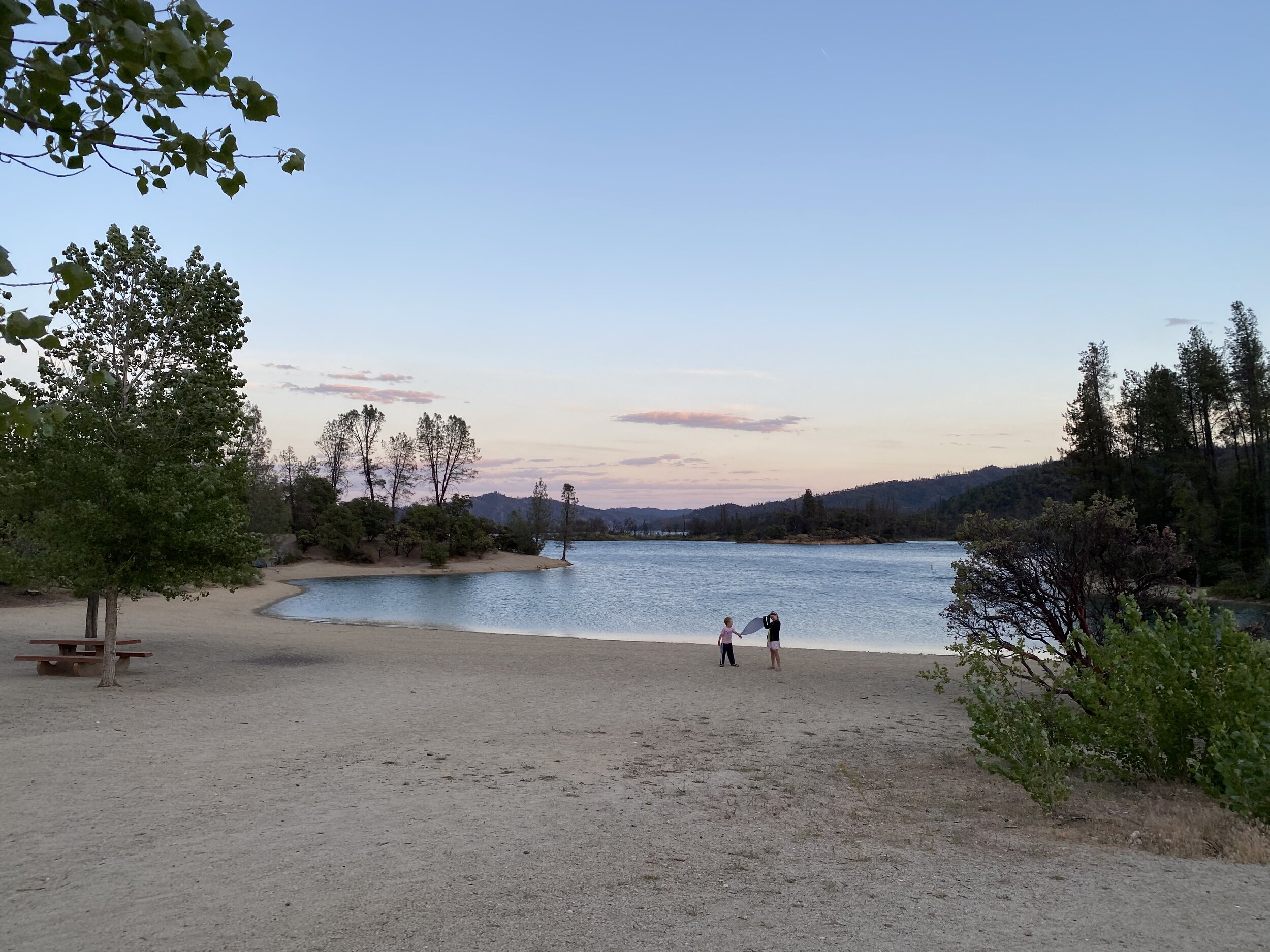 The kids play on a windy night at Oak Bottom Beach in Whiskeytown National Recreation Area near Redding, CA.  Photo by Karen Boudreaux, June 7, 2021
