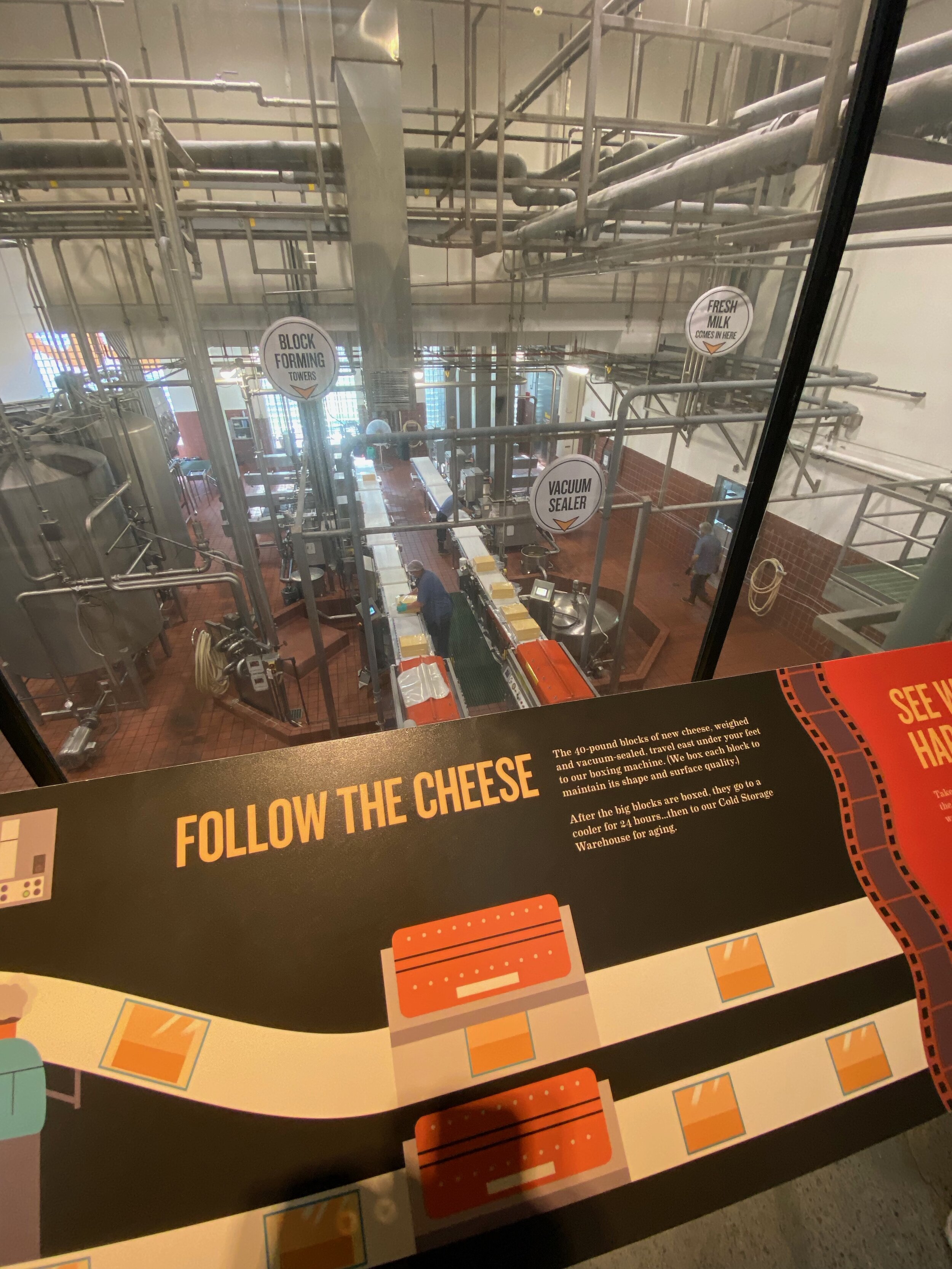 Informative signs at every window show you what you are looking at as they lead the way through the entire cheese-making process.  Photo by Karen Boudreaux, June 14, 2021