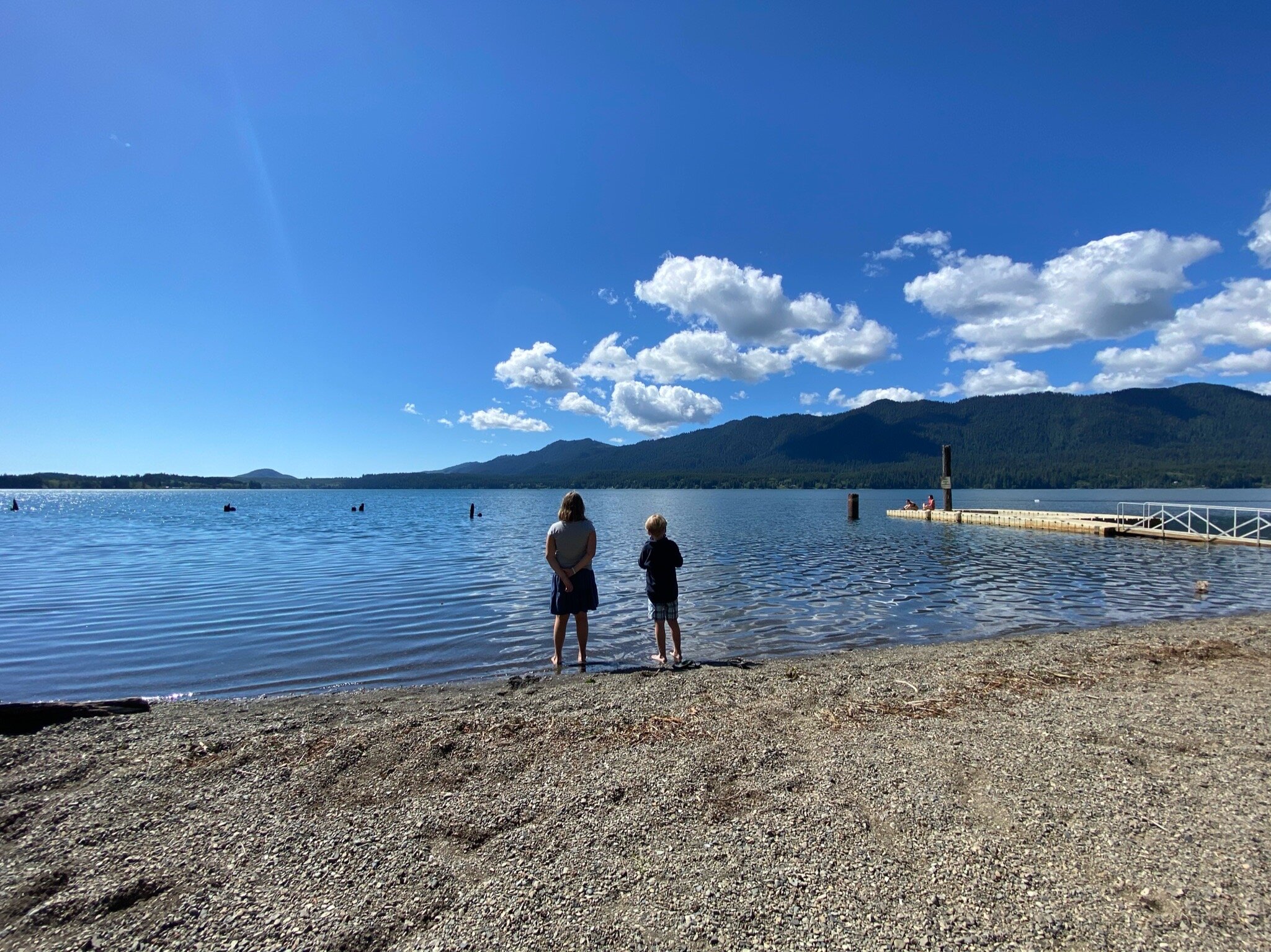 The kids look out over Lake Quinault from the beach at the Lake Quinault Lodge
