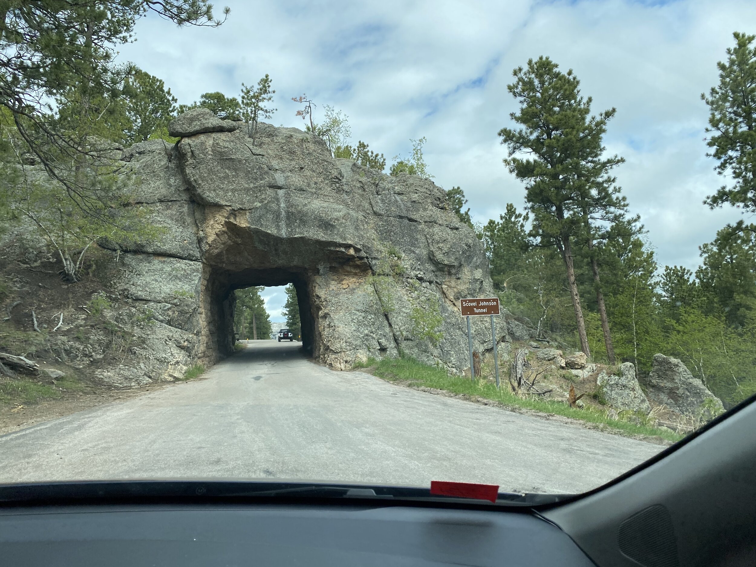 One of many neat (though narrow) tunnels that end up framing another new view of Mount Rushmore.  Photo by Karen Boudreaux, May 26, 2021