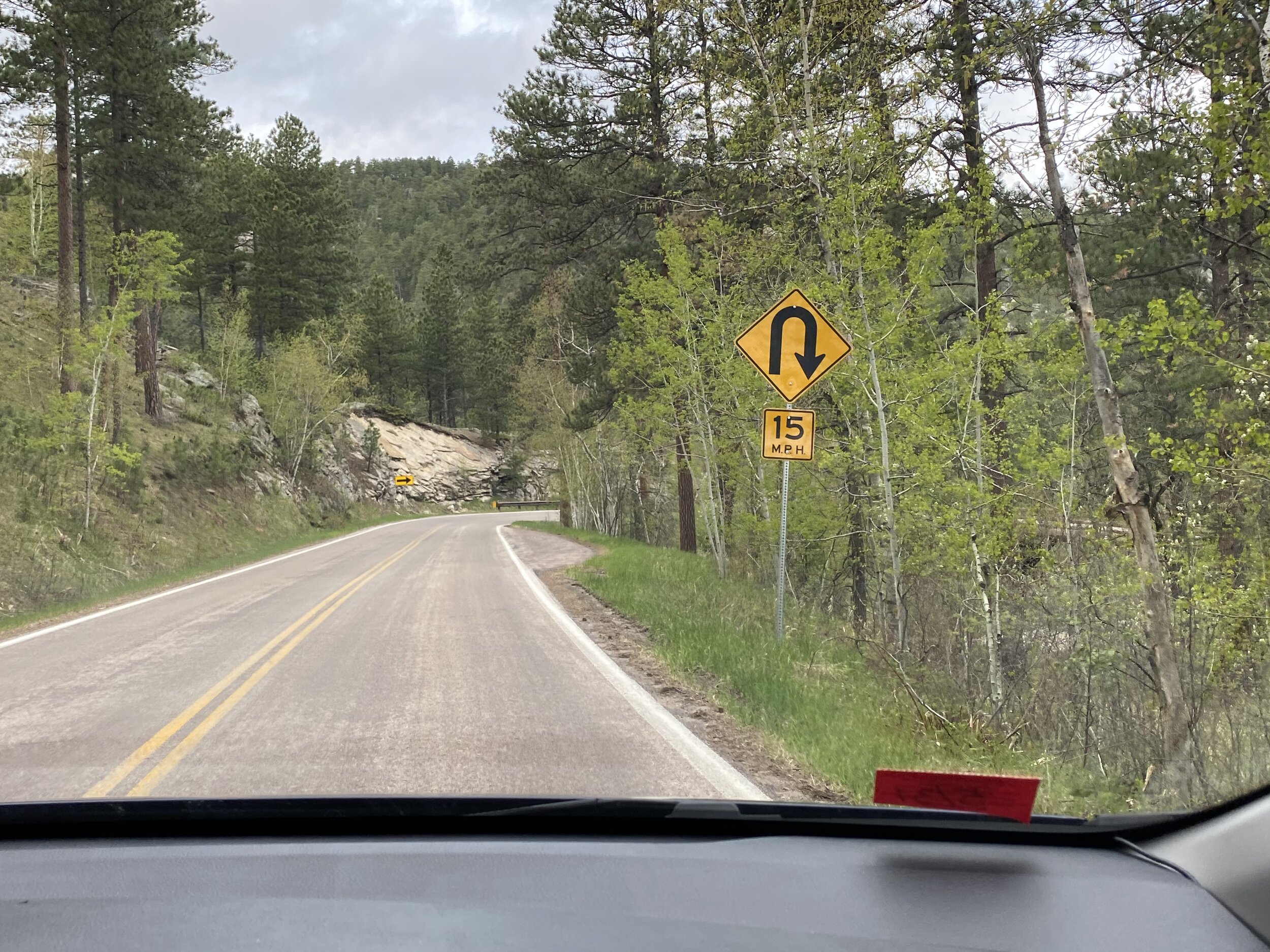 Sharp switchback turns require much lower speeds but more time to enjoy the views!  Photo by Karen Boudreaux, May 26, 2021