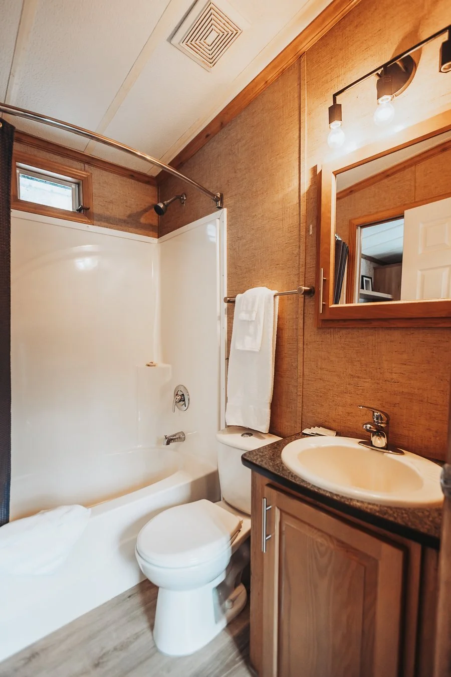 Hatchery Cabin 5 bathroom with a tub and shower