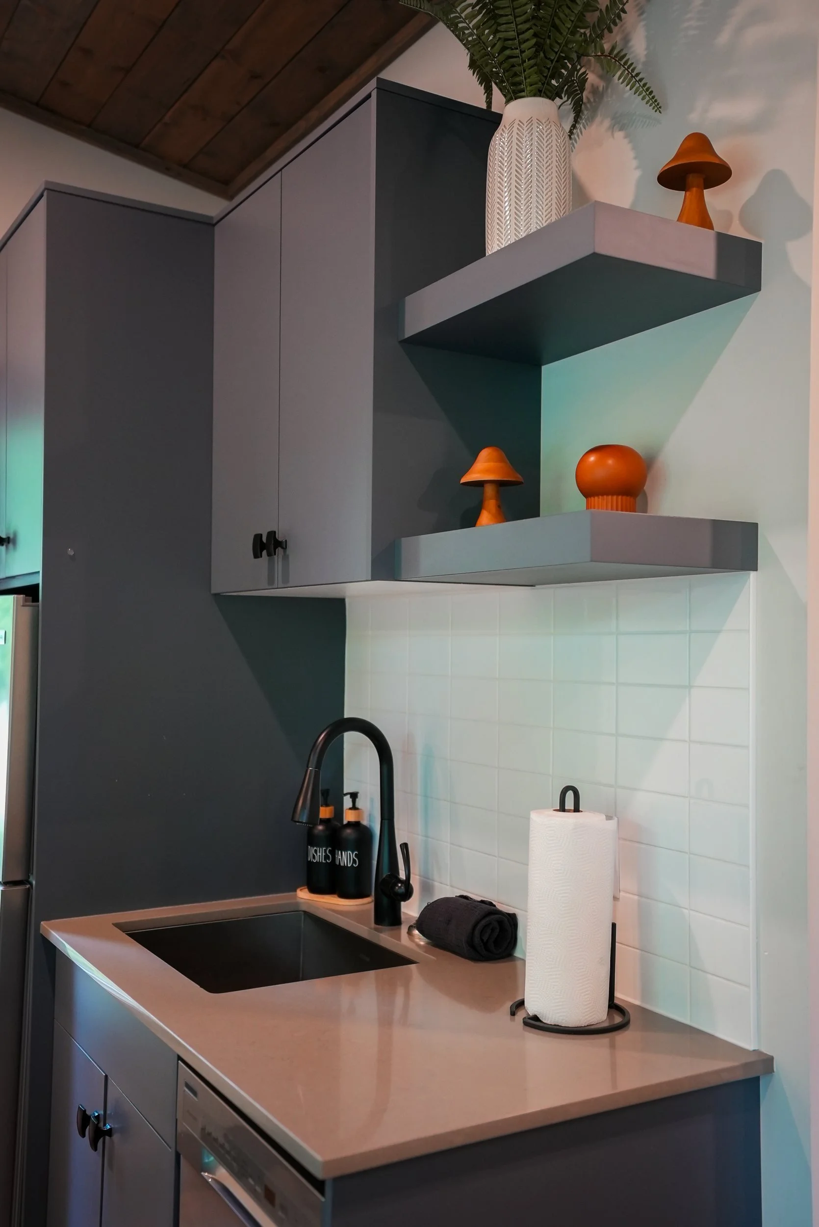 Monashee kitchenette with a sink and floating shelves