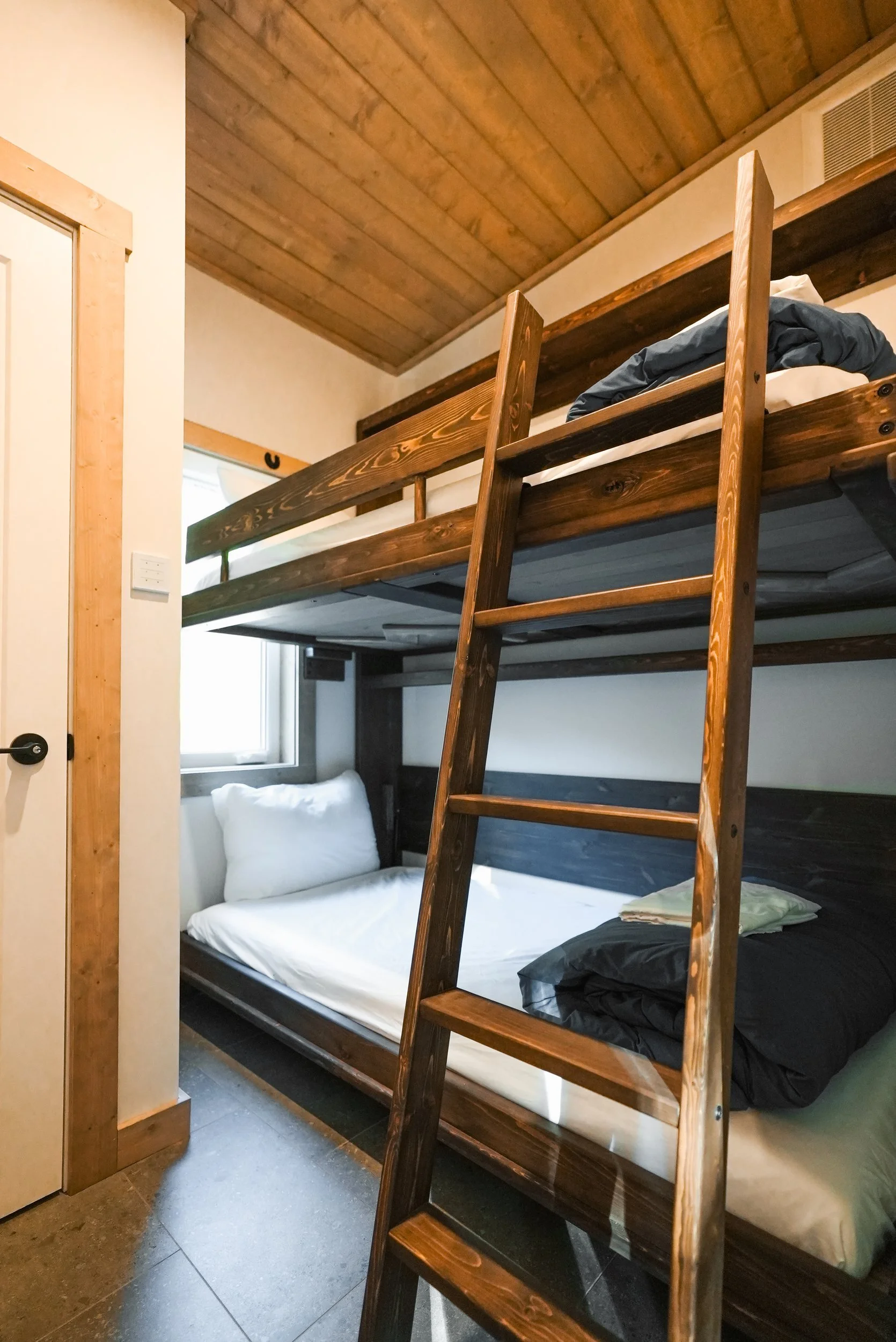 Wooden bunk beds in the Selkirk bunk room