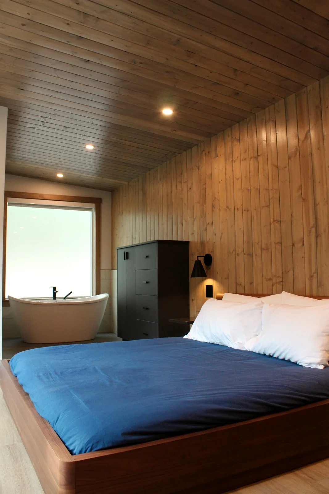The Nest studio, with the king bed and the freestanding soaker tub in the same room