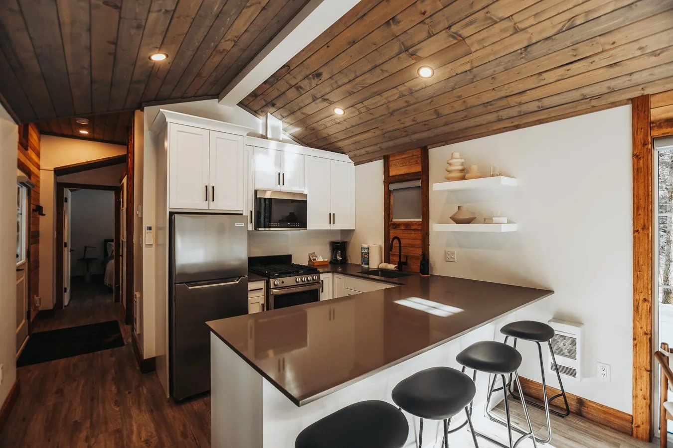Elkhorn kitchen with dark countertops and a breakfast bar
