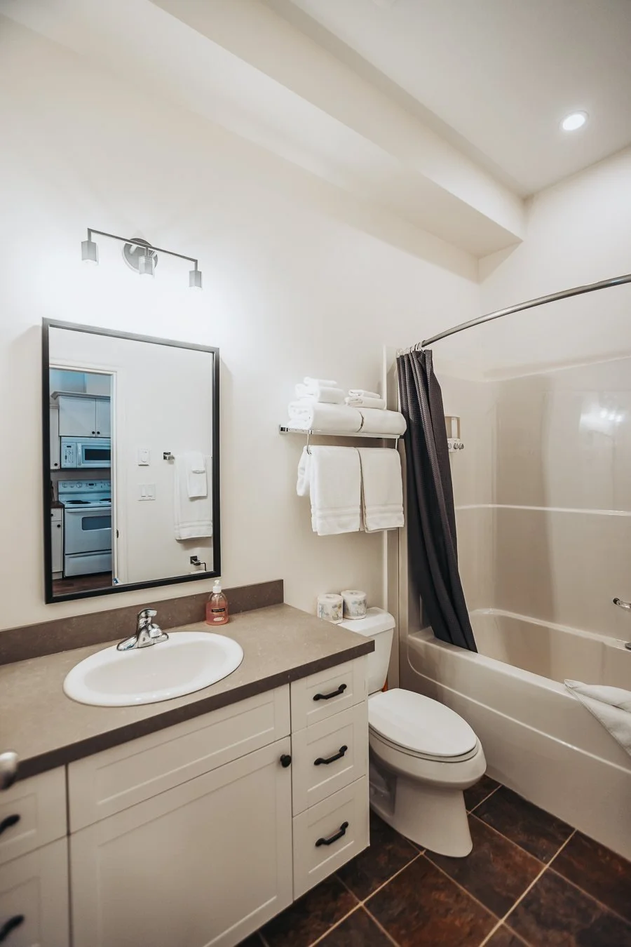 Hatchery suite bathroom with a tub and shower