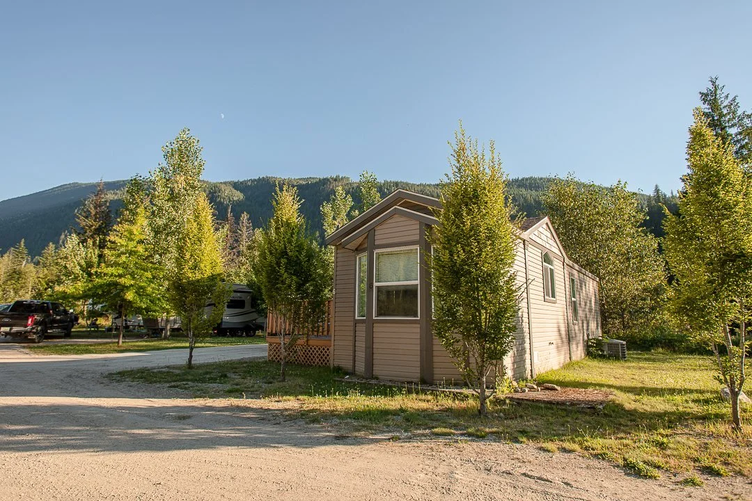 Hatchery Cabin 5 in summer, with mountains behind