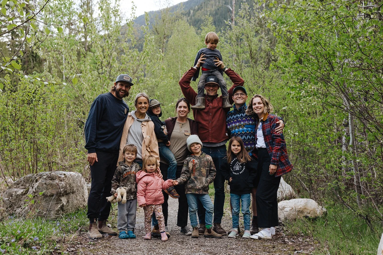 A group of parents and kids together on a forest trail at Crazy Creek