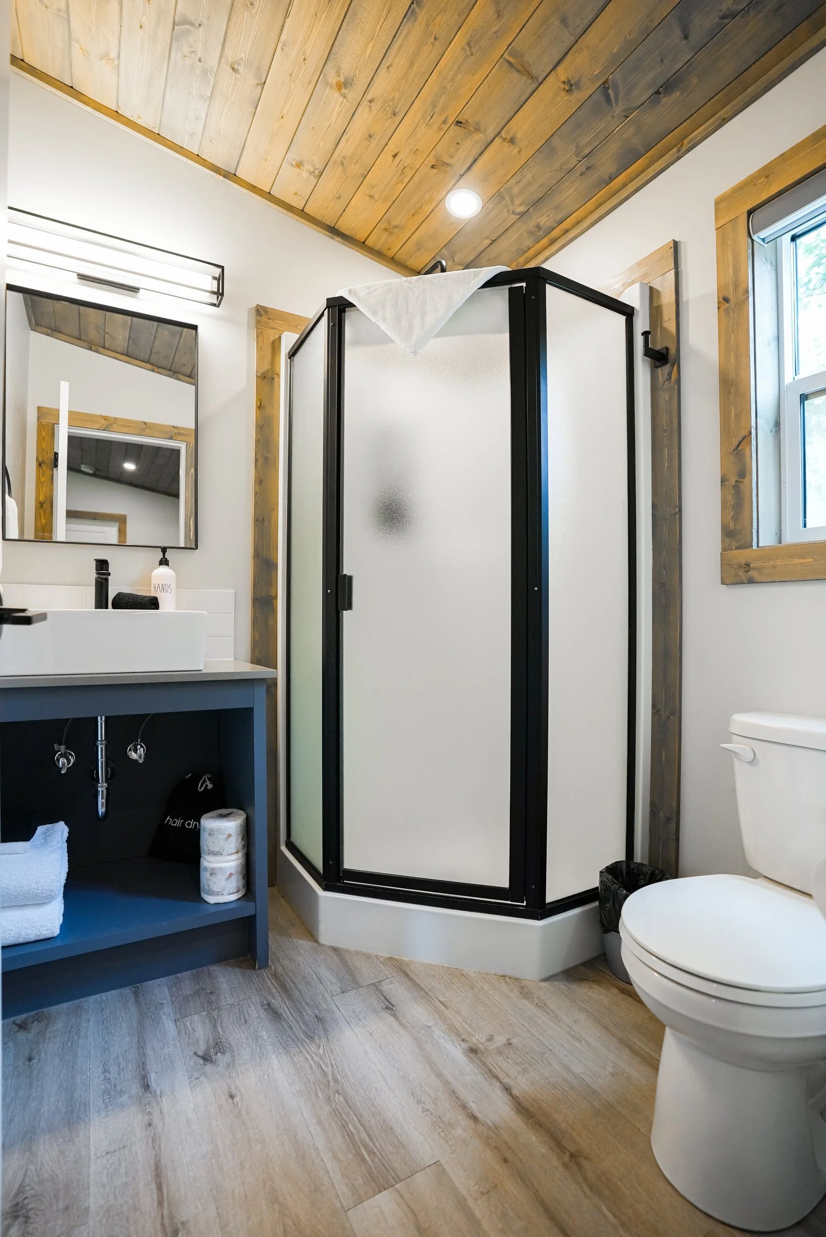 Monashee bathroom with a corner glass shower