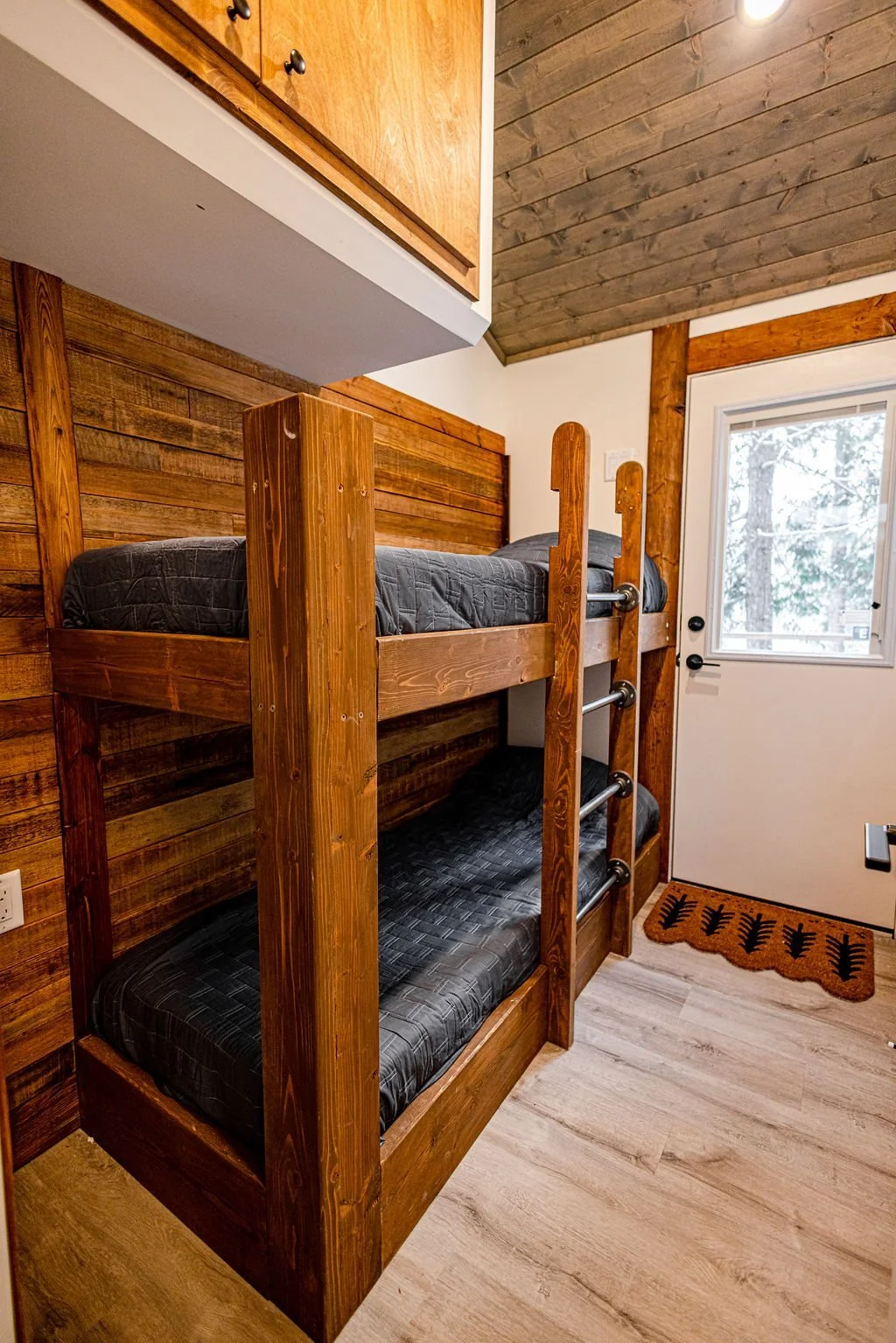 Wooden bunk beds in the kids bunk room at the Apex