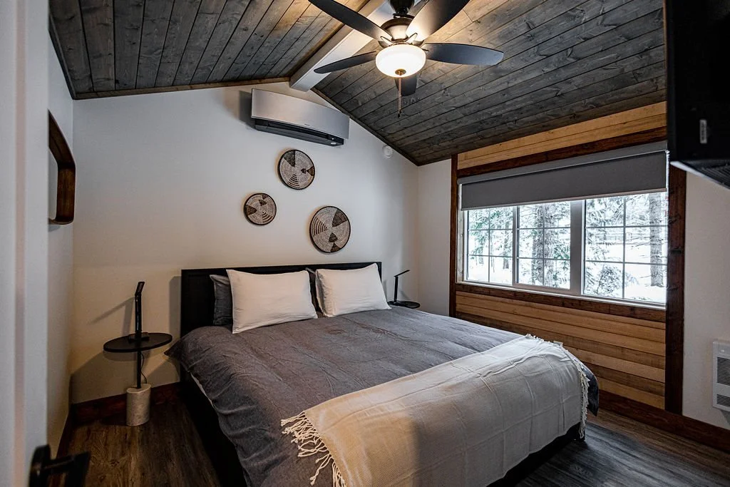 Elkhorn king bedroom with a ceiling fan and wood ceiling