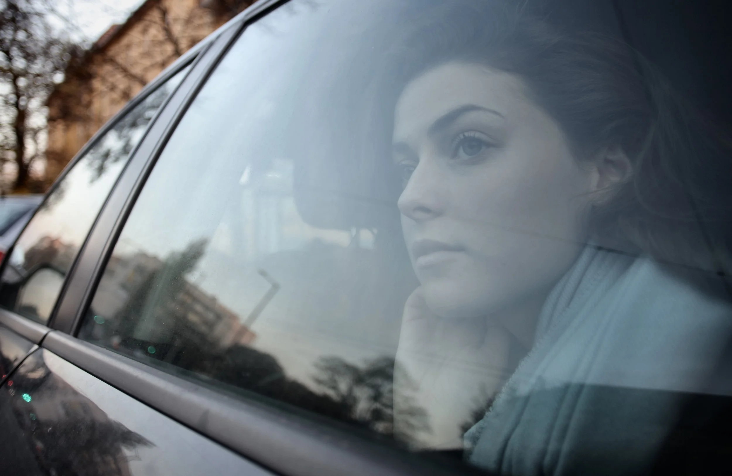 Person exhaling alone in their car, the body's signals about a relationship