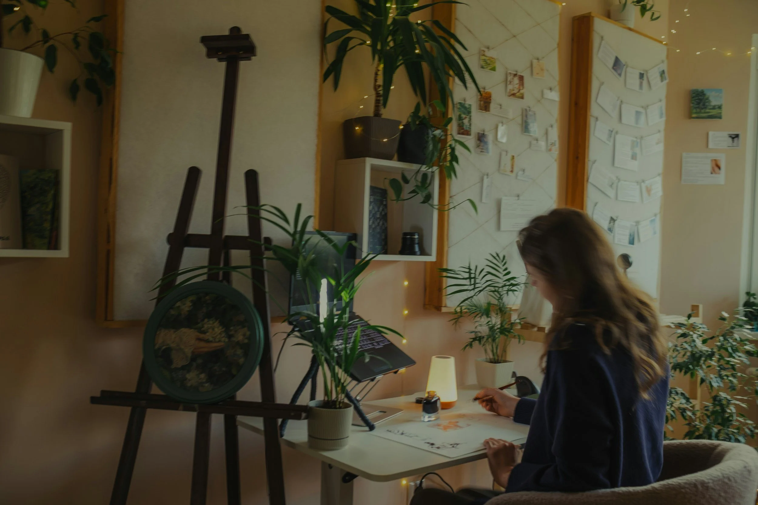 A client completes an ADHD assessment questionnaire across from a clinician in a warmly lit office, showing how approachable ADHD testing can be.