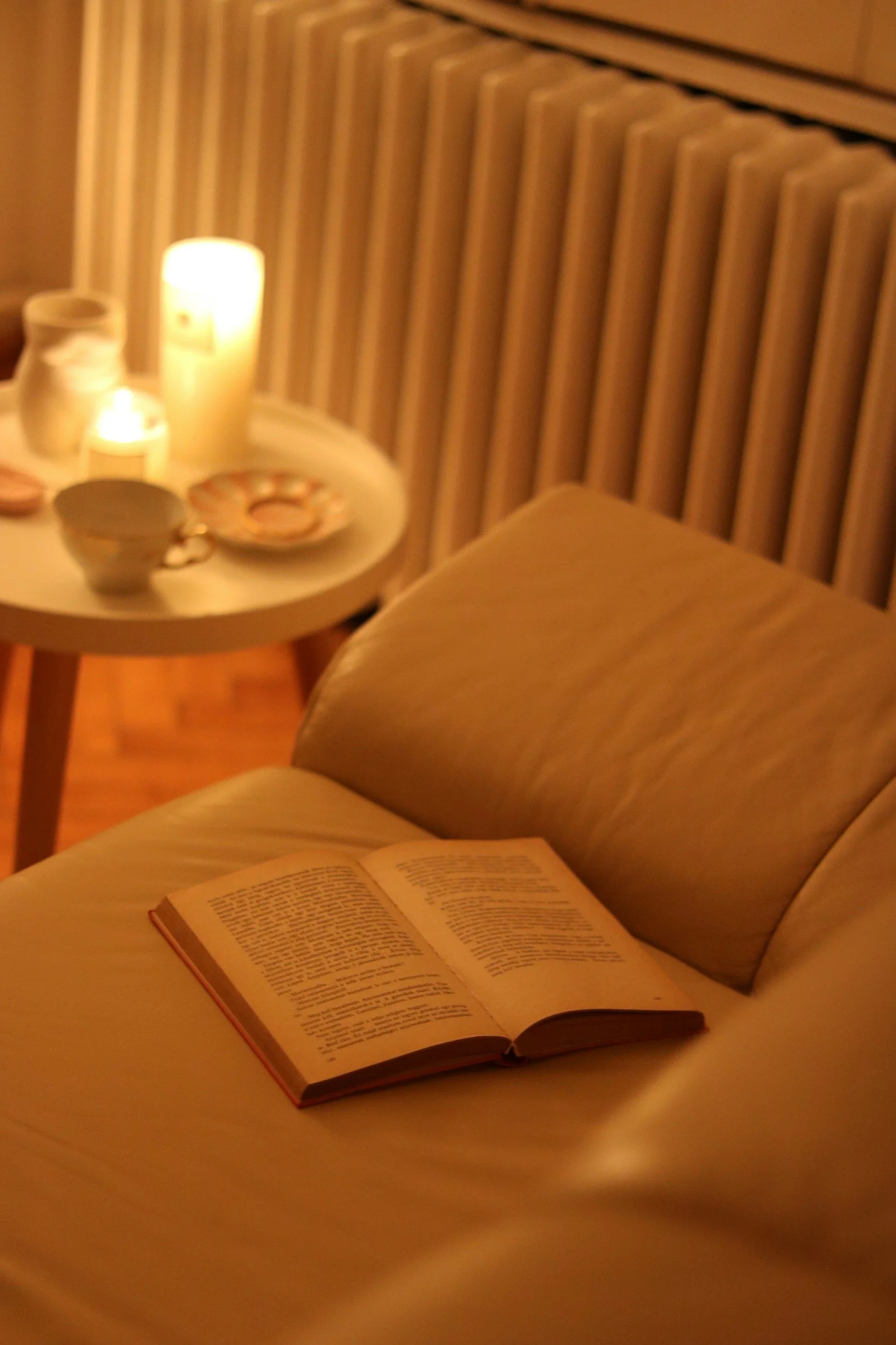 Quiet evening with a book and warm lamp, the phone resting across the room