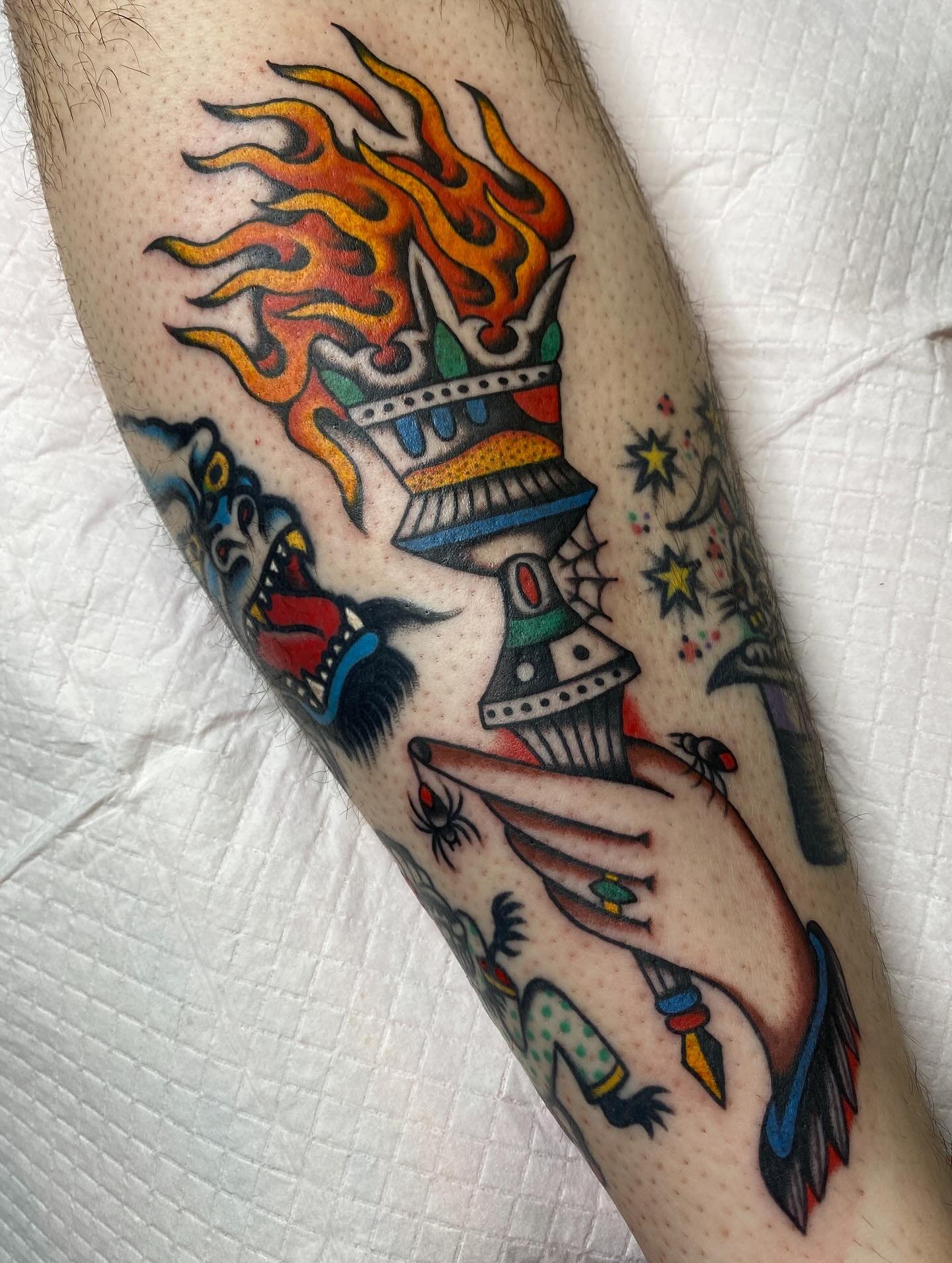 I got to tattoo this torch on friend @bohn.jrown recently. He came in and was patient while I made the design fit nicely amongst some wonderful @habitholes and @mjforrest_ 
We talked about music and tv and movies and reminisced on hardcore shows we&r