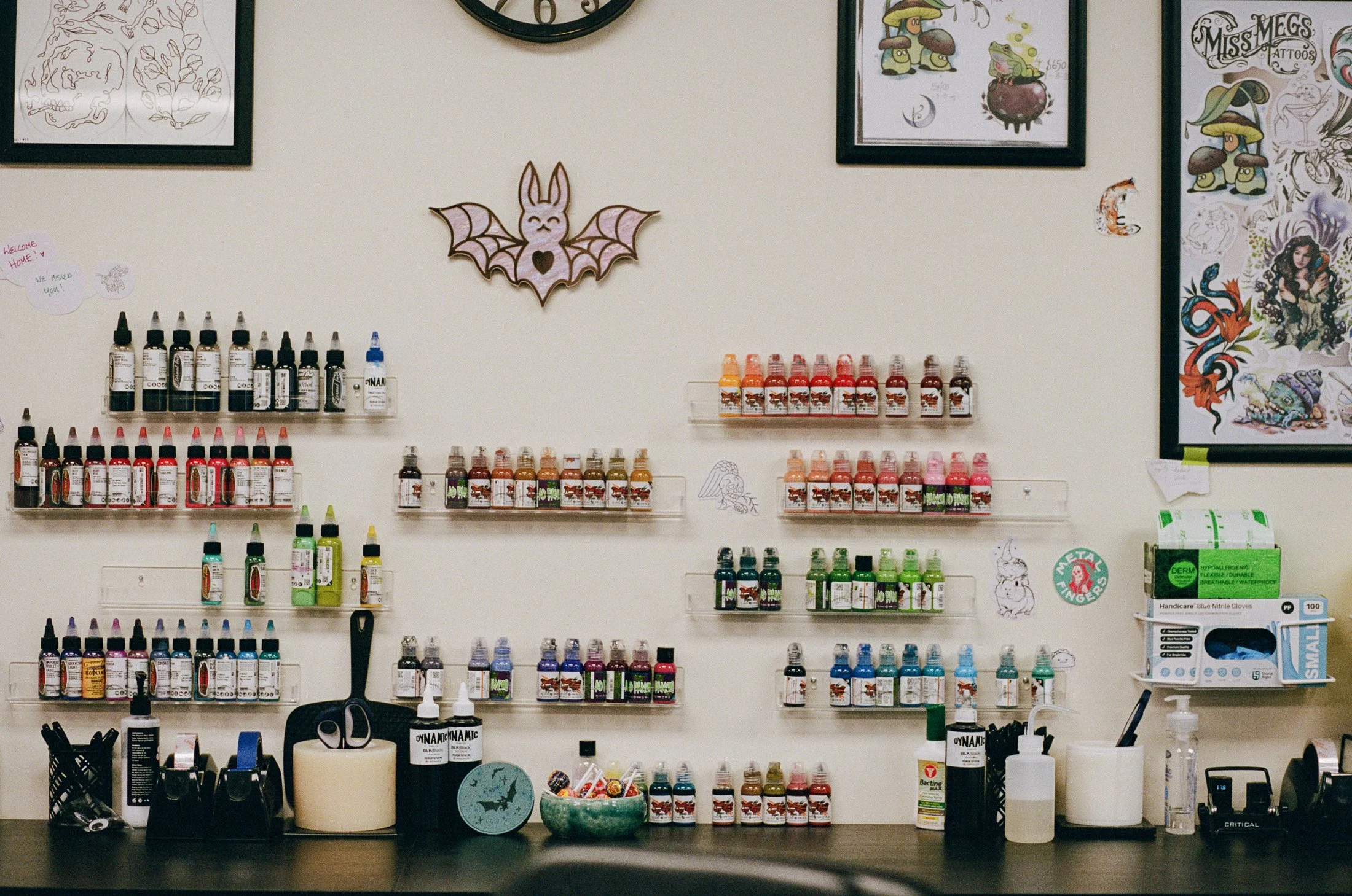 Tattoo studio interior featuring inks, artwork and creative tools photographed as part of The Maker Series.
