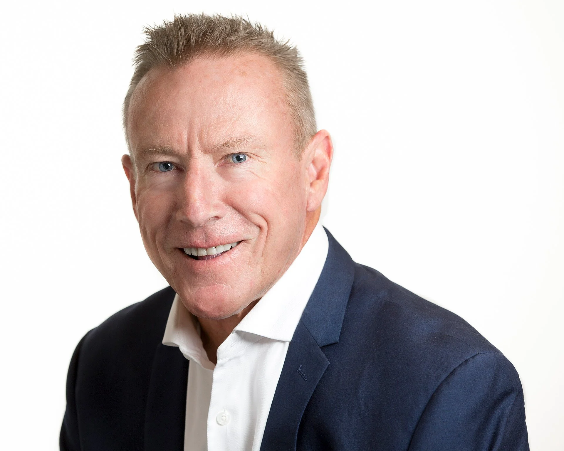 Polished corporate headshot of man in suit by Natalie Finney Photography