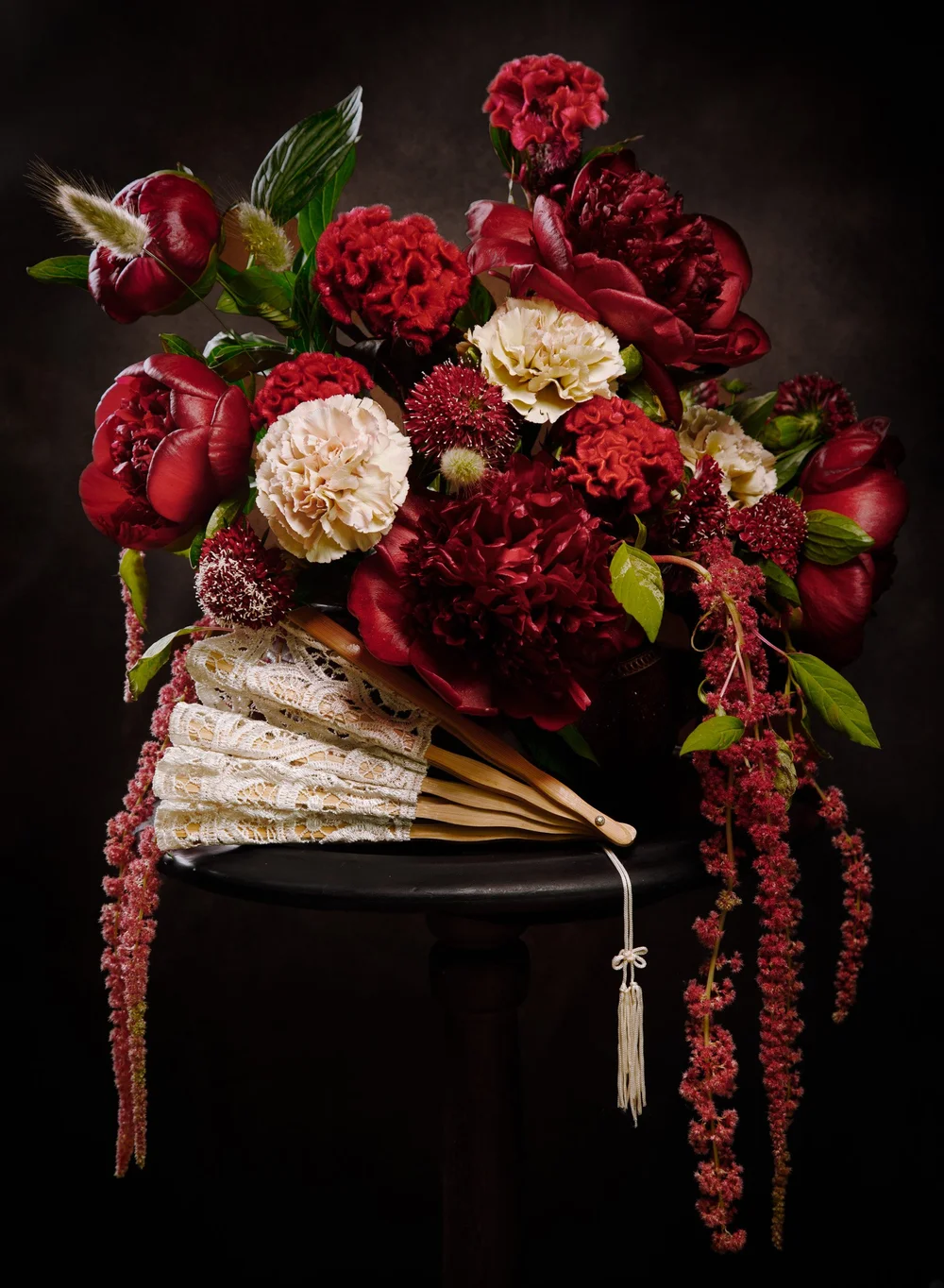 WEB_Red Florals on pedestal with lace fan.JPG