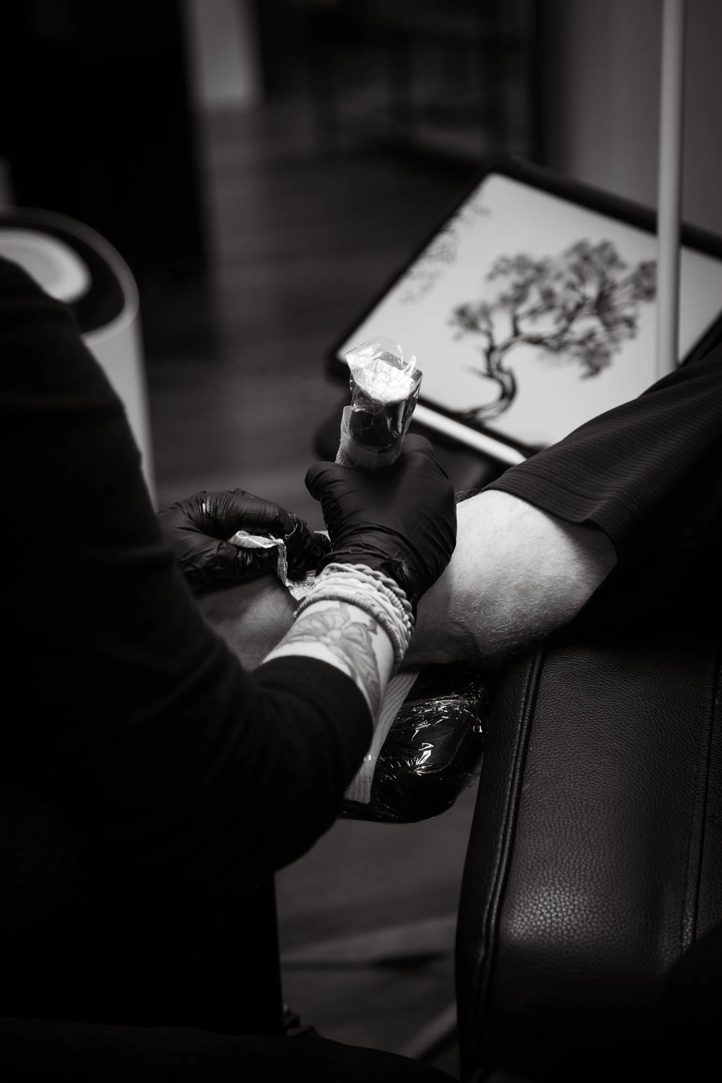 Tattoo artist at work in a Melbourne studio captured as part of The Maker Series creative portrait sessions.