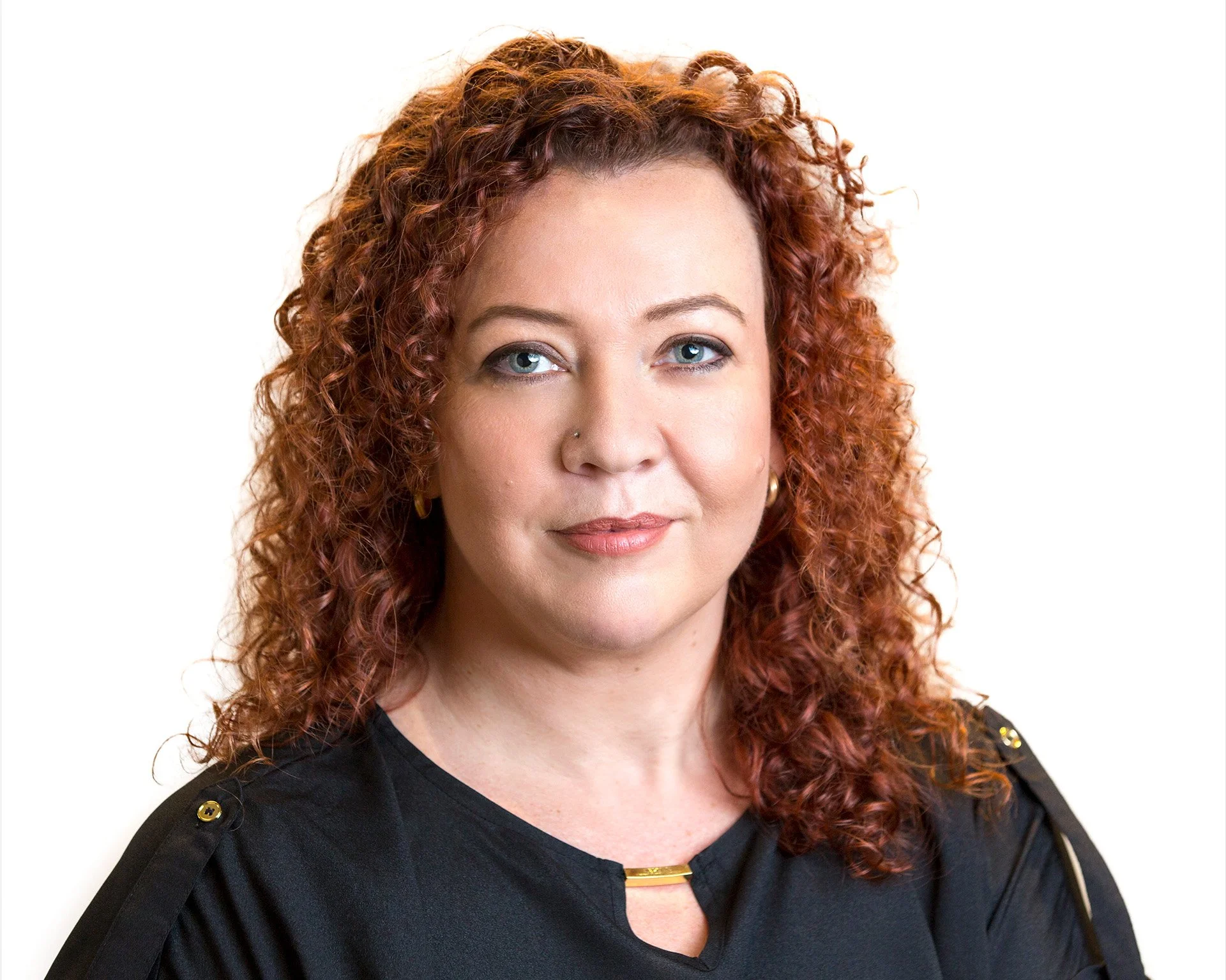 Polished corporate headshot of a woman with a white background by Natalie Finney Photography