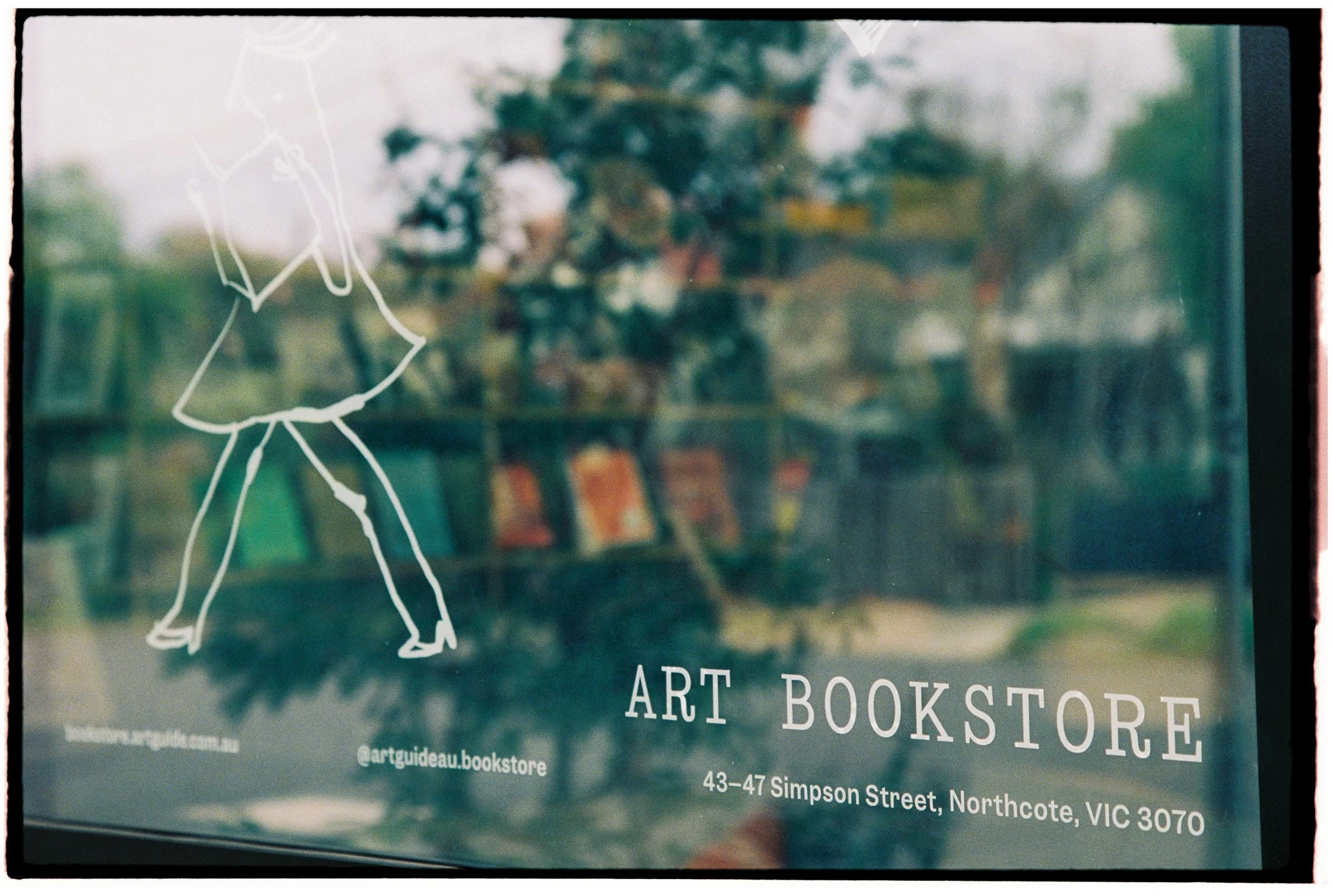 Exterior window view of an independent Melbourne art bookstore photographed during a creative practice documentation session.