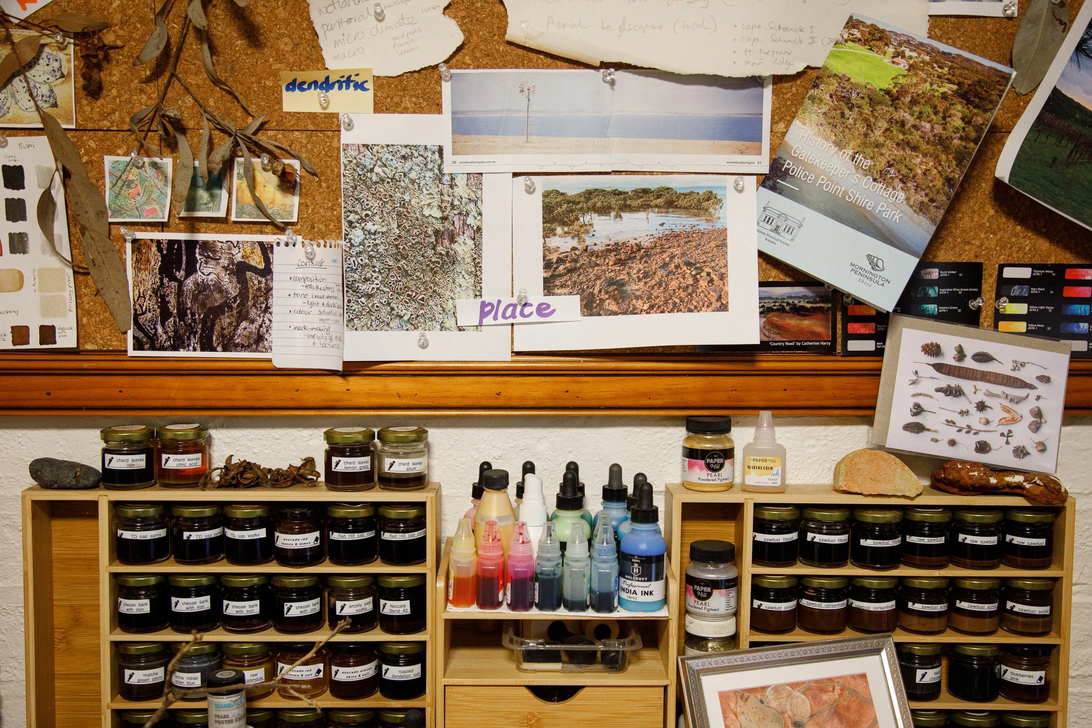 Artist studio workspace featuring creative materials, paints, sketches and visual references during a Melbourne Maker Series photography session.