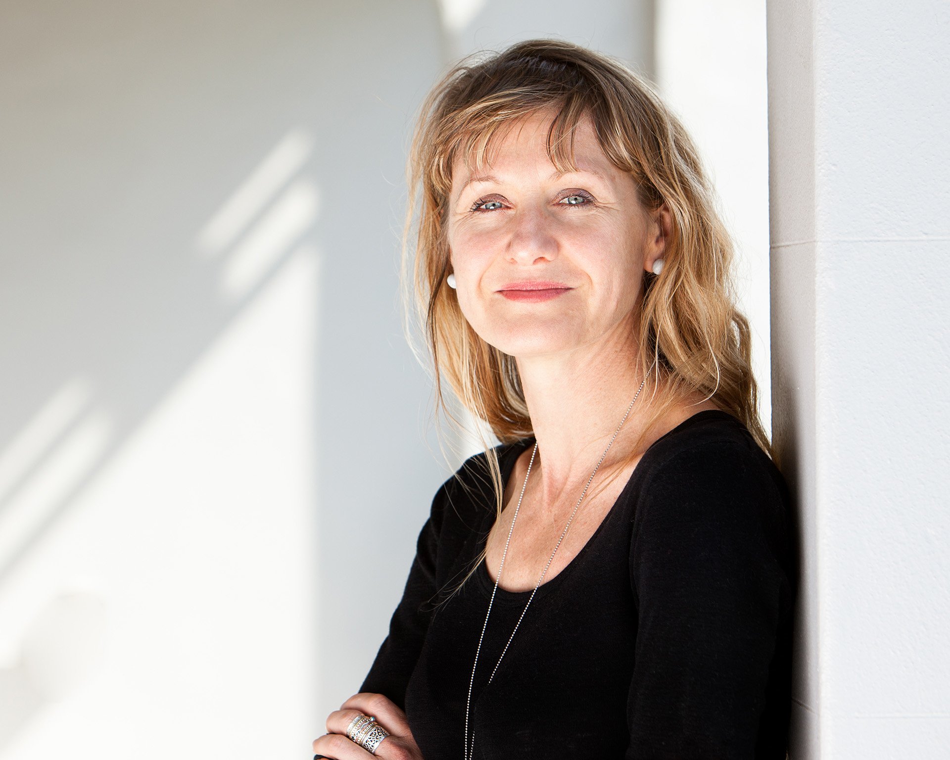 Natural light headshot of a woman outdoors by Natalie Finney Photography