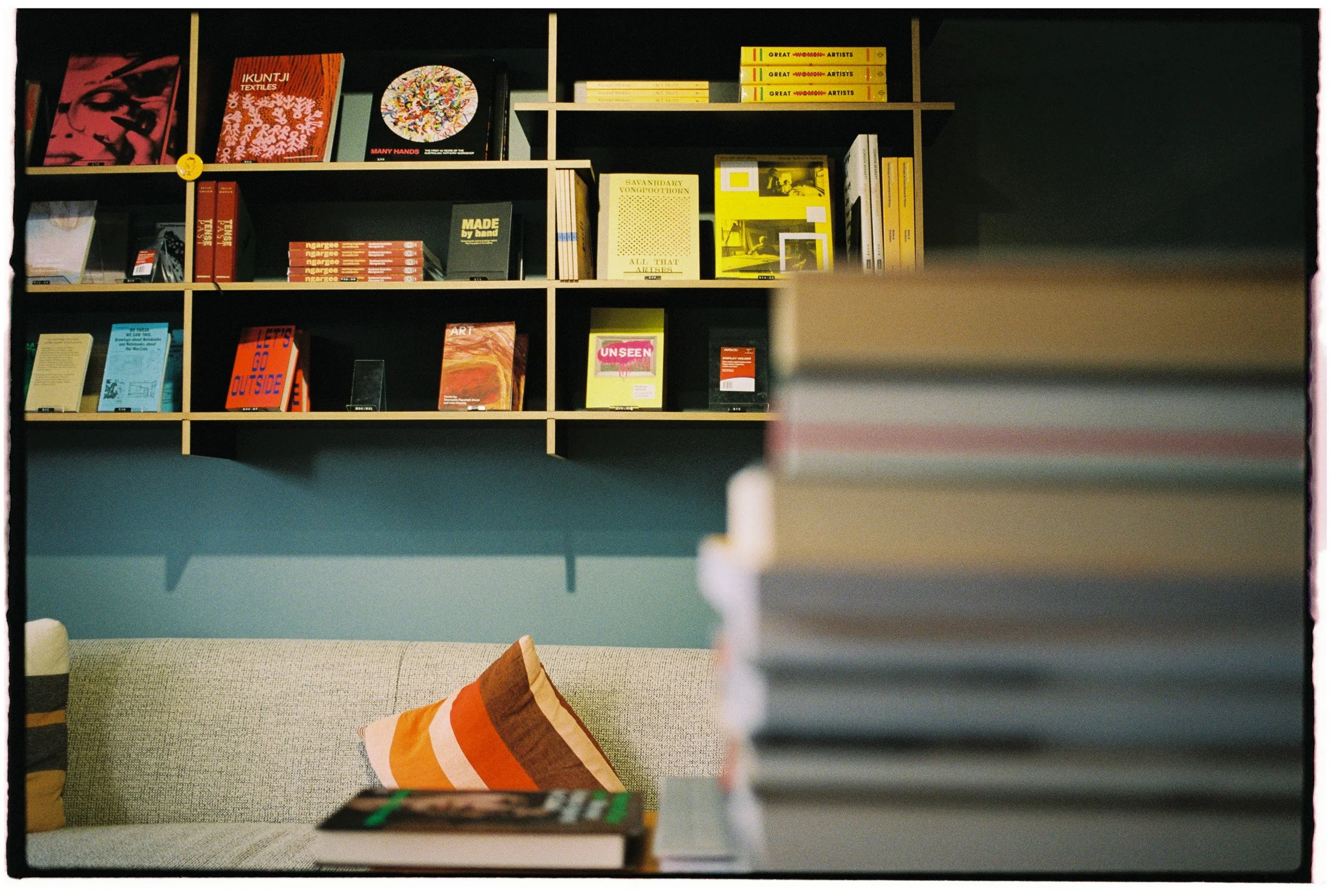 Interior photograph of bookshelves and curated displays inside an independent Melbourne bookstore.