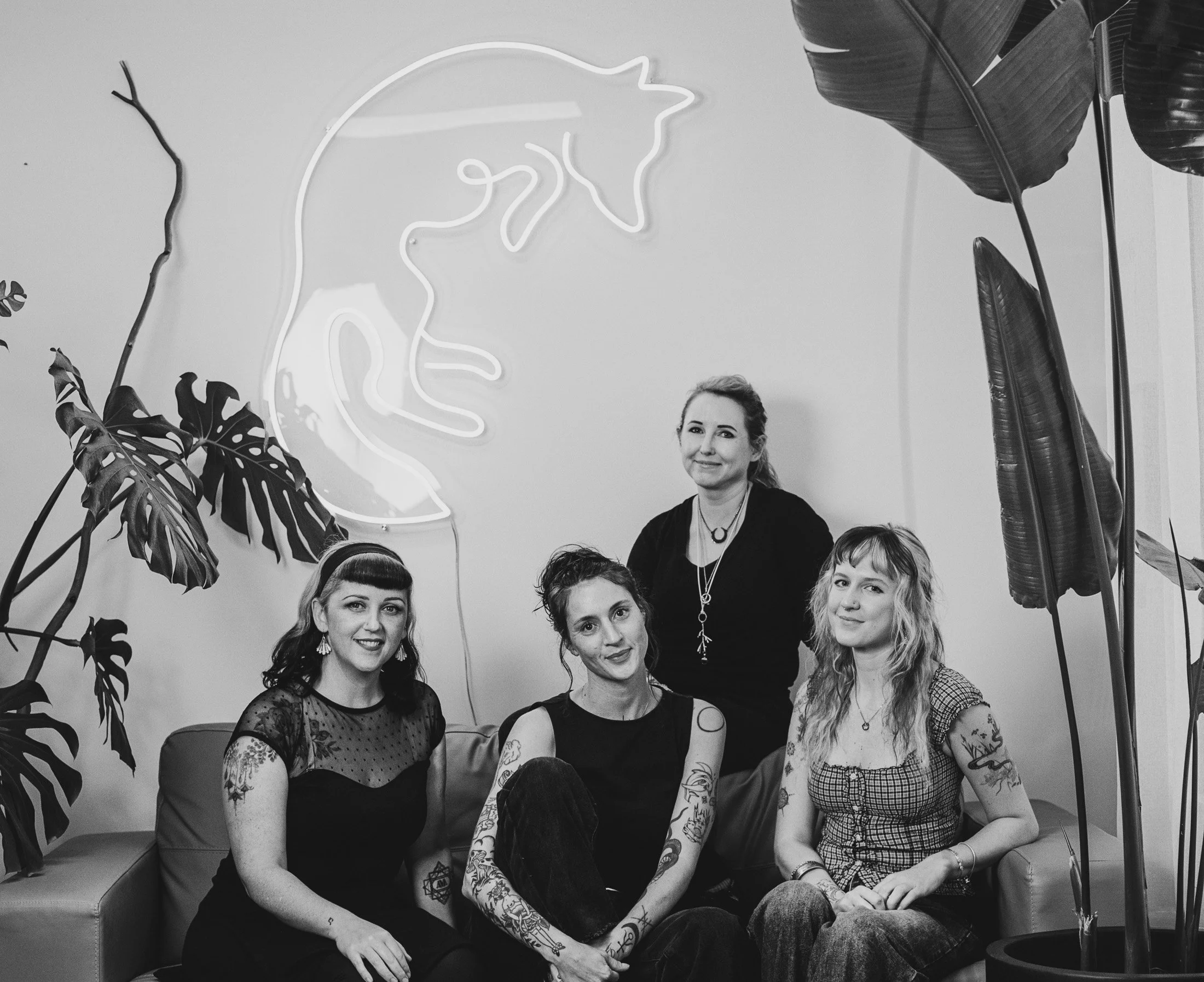 Group portrait of female tattoo artists photographed in their shared creative studio environment in Melbourne.