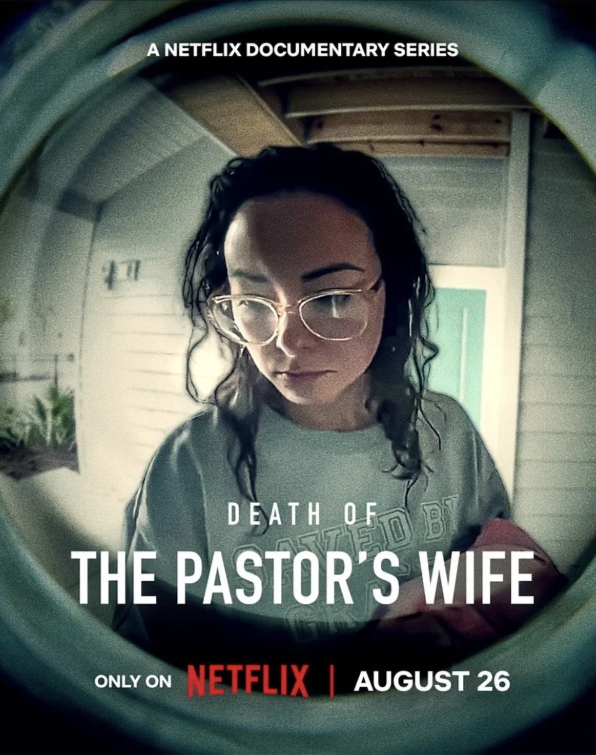 Poster for Netflix documentary series titled "Death of the Pastor's Wife," showing a woman with curly hair and glasses looking down, inside a washing machine or dryer with a circular opening.