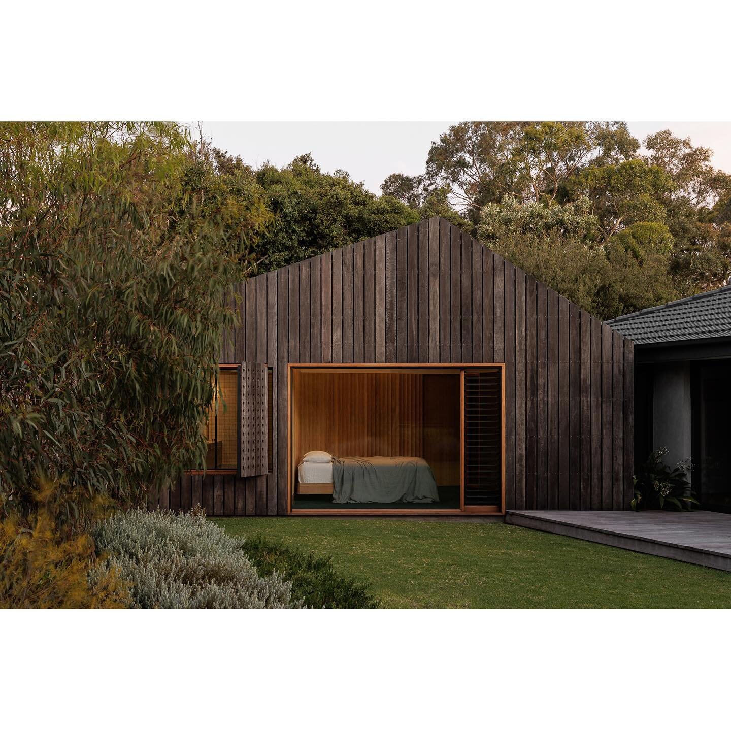POINT LONSDALE HOUSE &bull; The built form of Point Lonsdale House is intricately related to its context. The addition was designed as a modern interpretation of a gable roof, with a sloping roofline that follows the angle of the site. This not only 