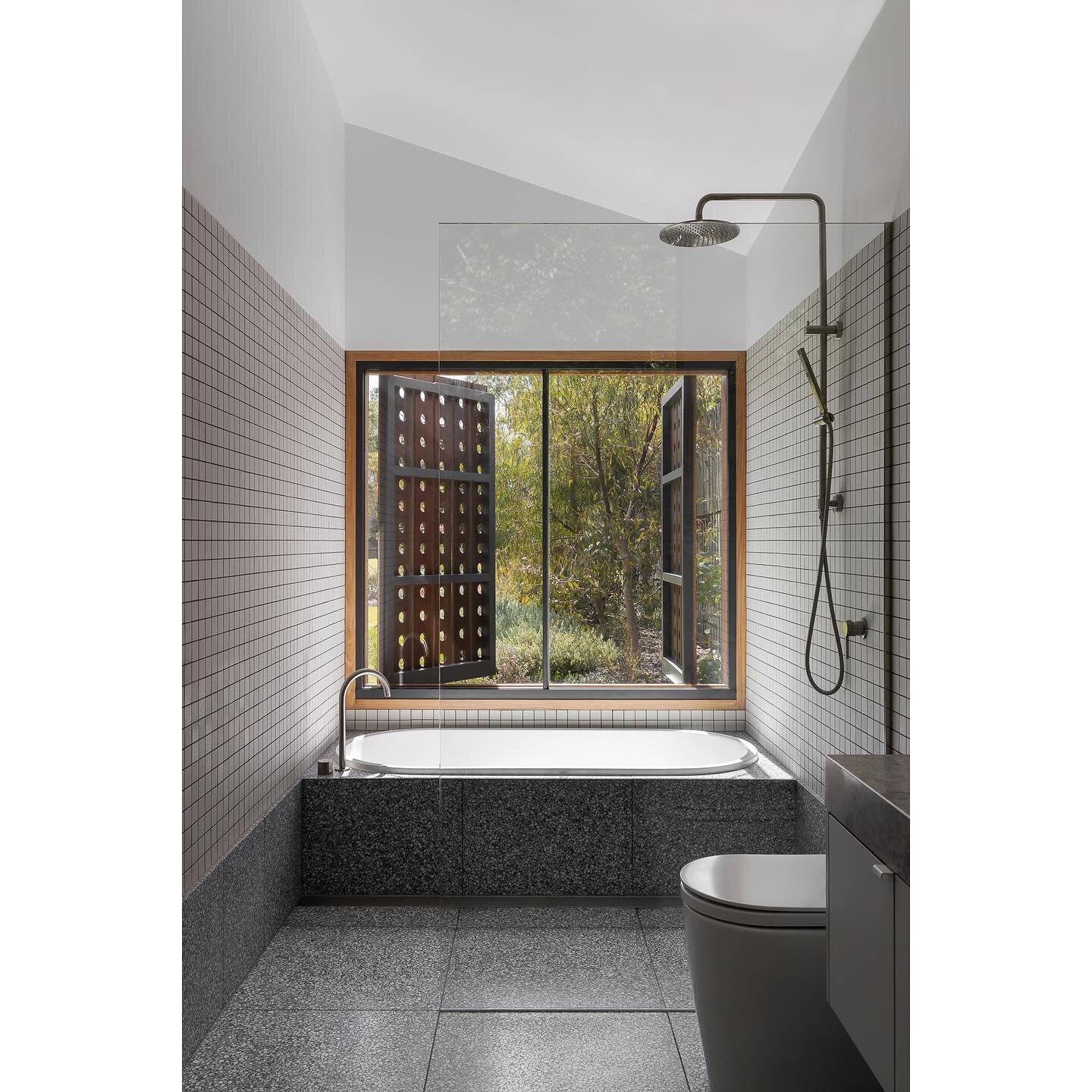 POINT LONSDALE HOUSE &bull; An operable perforated screen in the ensuite allows the clients to control the amount of privacy and light. They can either open the screens right up to enjoy the garden whilst having a bath, or close them as required. 

?