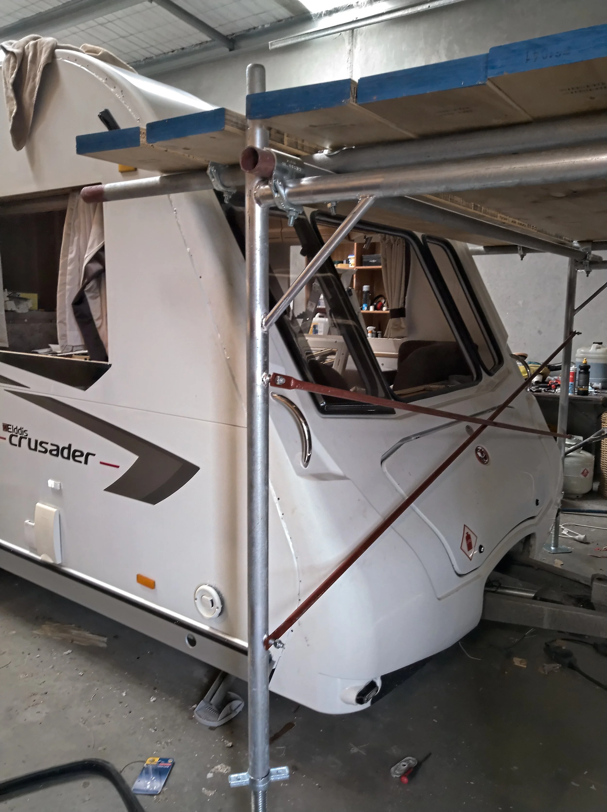 Further fitting of the front fascia including the grab handles, LED marker lamps, the front windows and the roof strip.