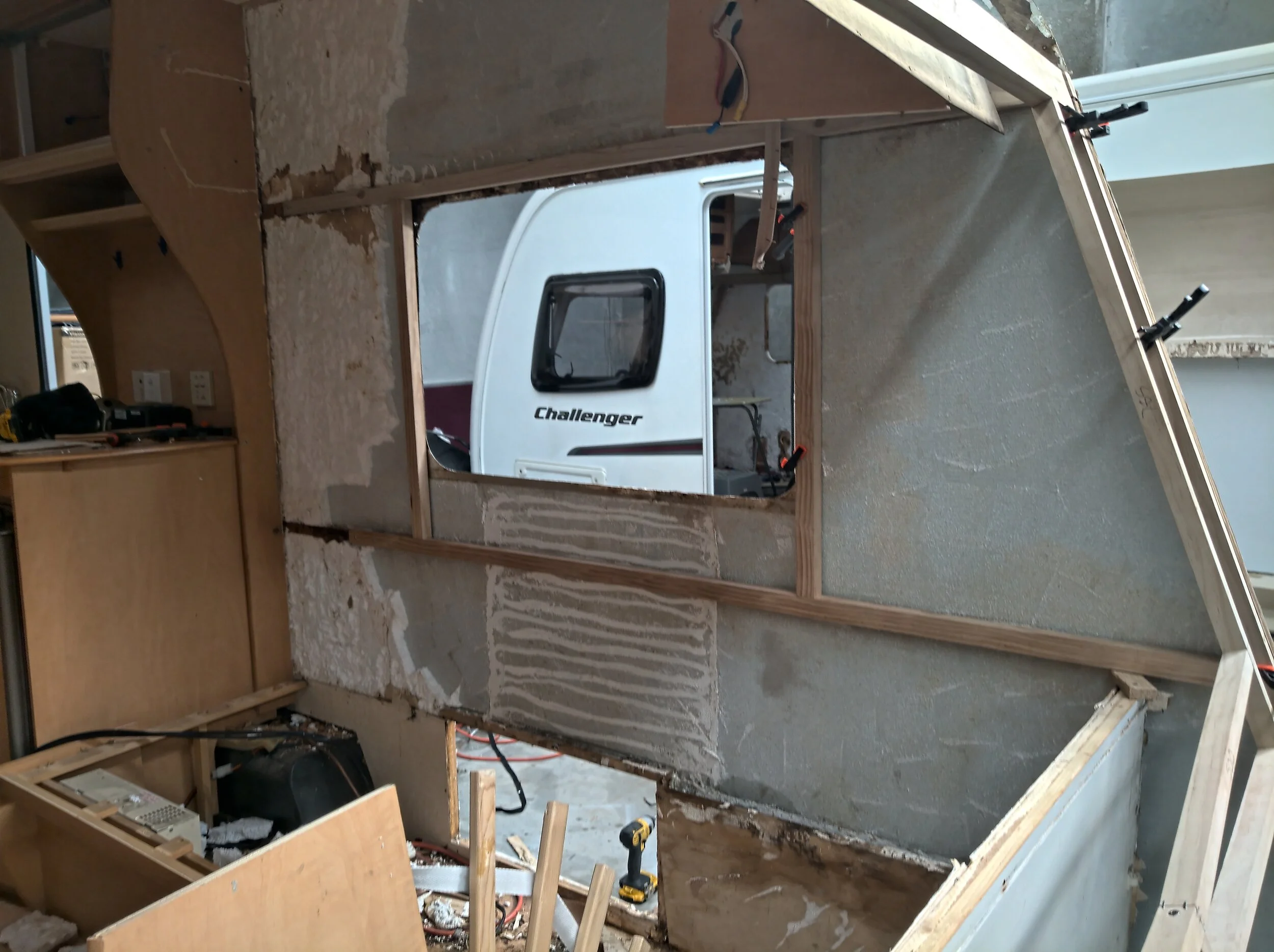 With some new framing bracing the wall, we can remove the last of the old patches.