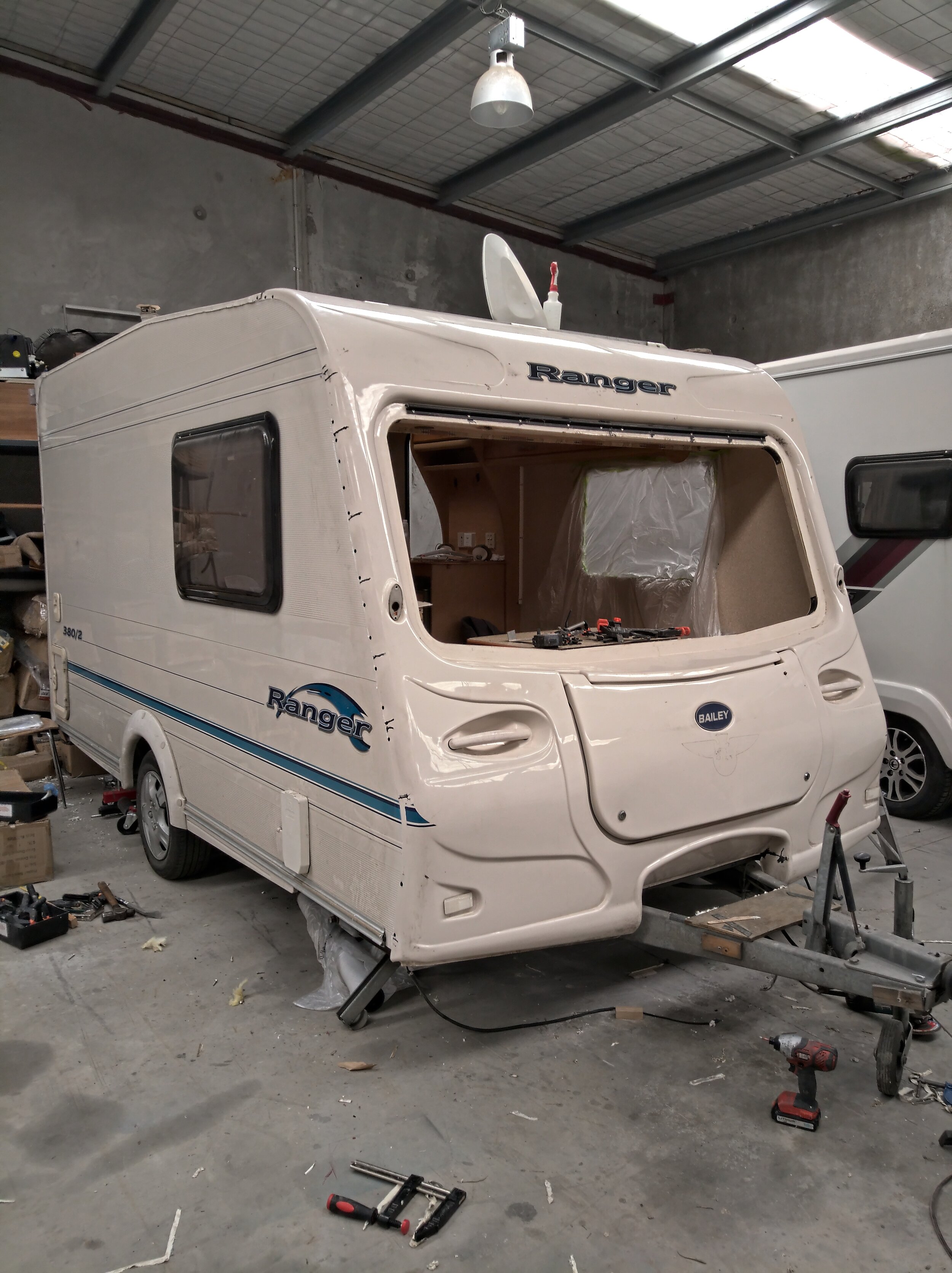 Front fascia refitted. Note the number of plastic welds required - the root cause of the failure was a crack in the top near-side corner of the fascia underneath the failed awning rail sealant.