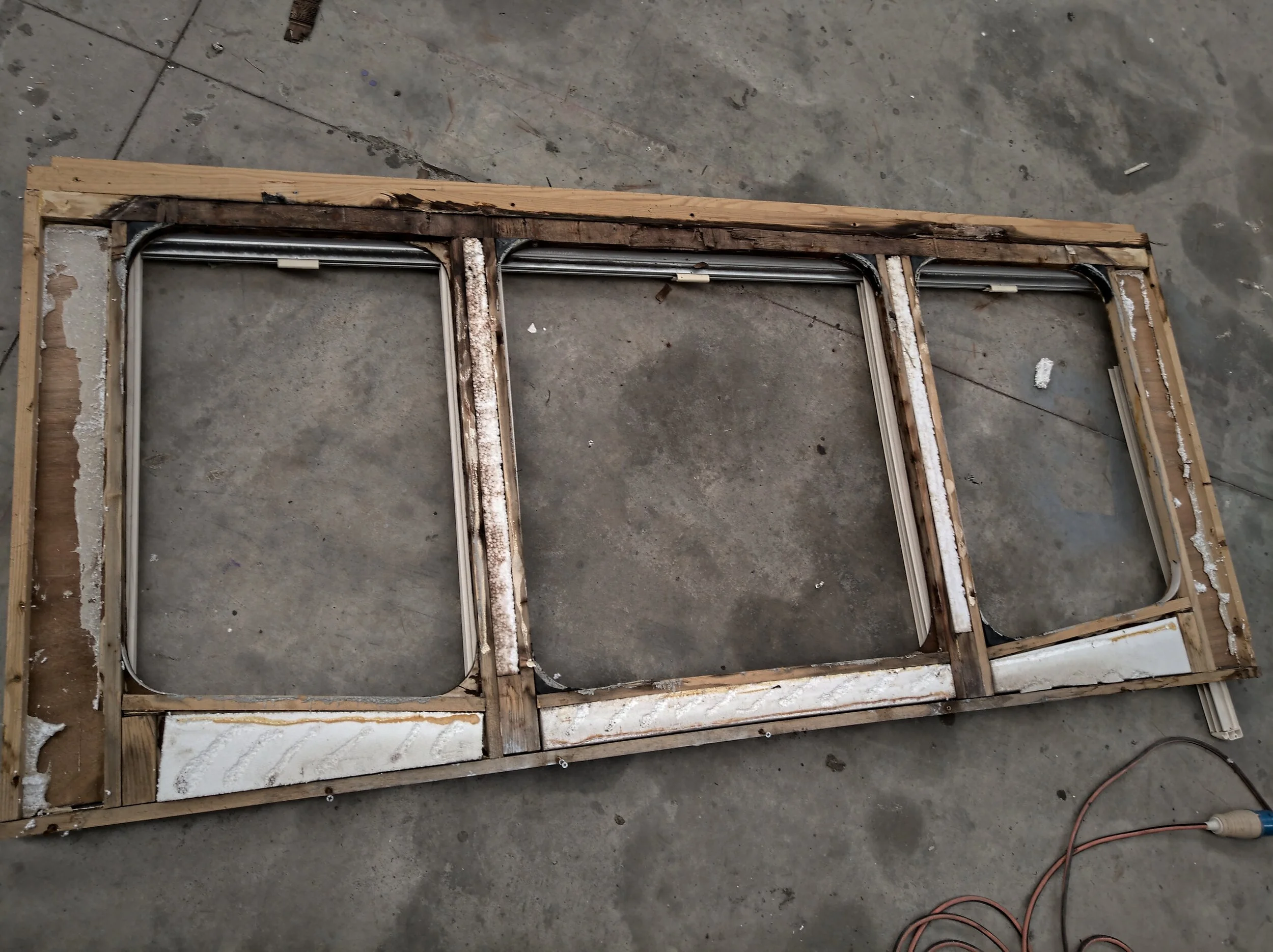 The front wall, as seen from the front. The top board is well beyond redemption, and a lot of the other timber wasn't far behind.