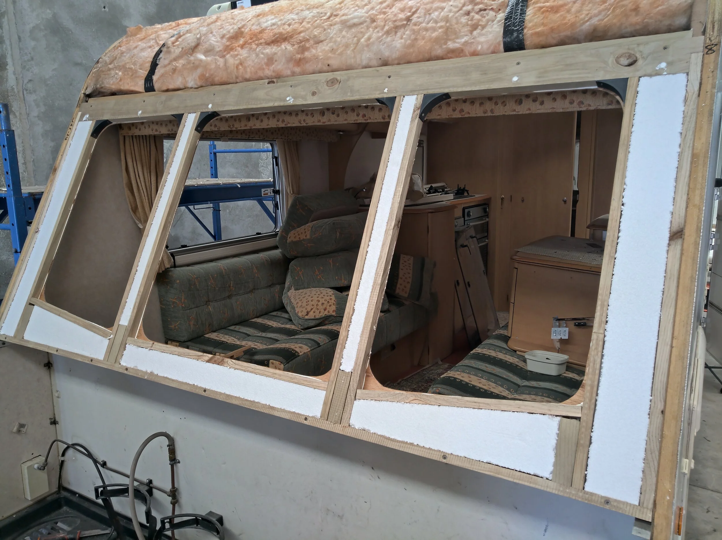 New front wall fitted up with new insulation and 3D printed corner caps, ready for reinstalling the fascia.