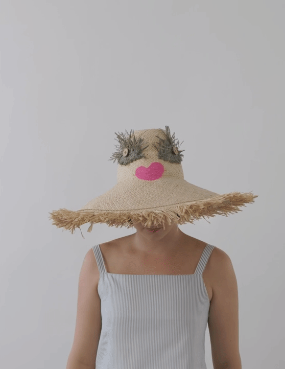 Made for the fun-lover, the big lashed raffia eyes and pouty vinyl lips will call out for all the attention you need.