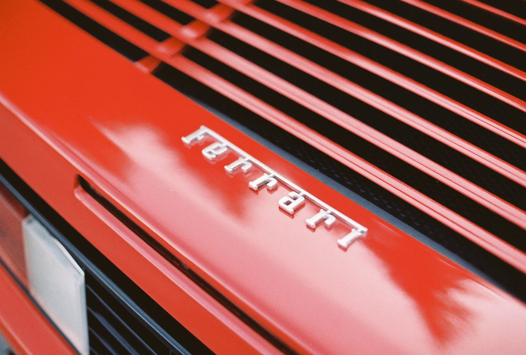 Chrome Ferrari lettering and red engine-cover slats, photographed on Kodacolor 200 film.