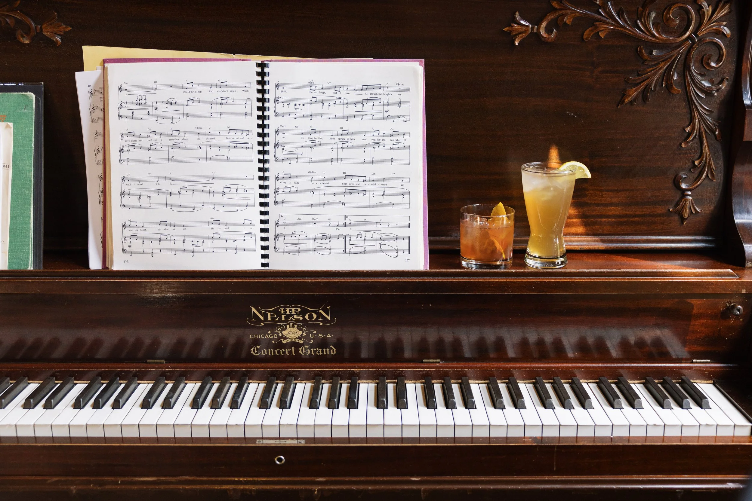 piano with two cocktails on top