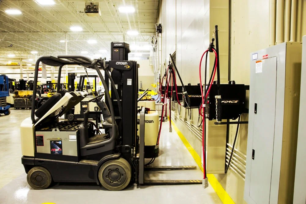 Professional electrical installation showing dedicated circuits and wiring for several industrial forklift battery charging stations.
