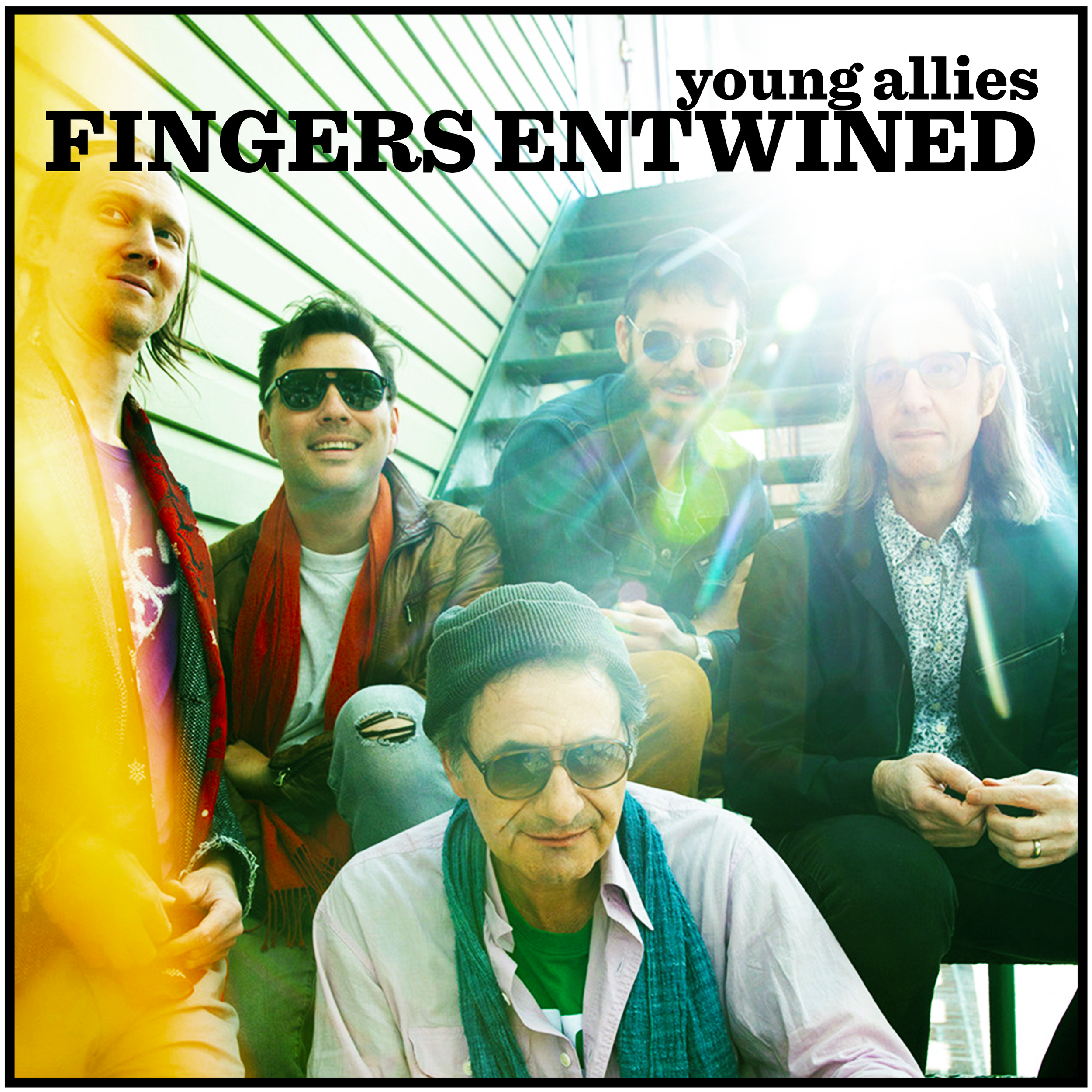 Album art for Young Allies' first single Fingers Entwined: Band members Isaac, Phil, Fritz, Gavin and Tosh sitting on an iron staircase in NYC.