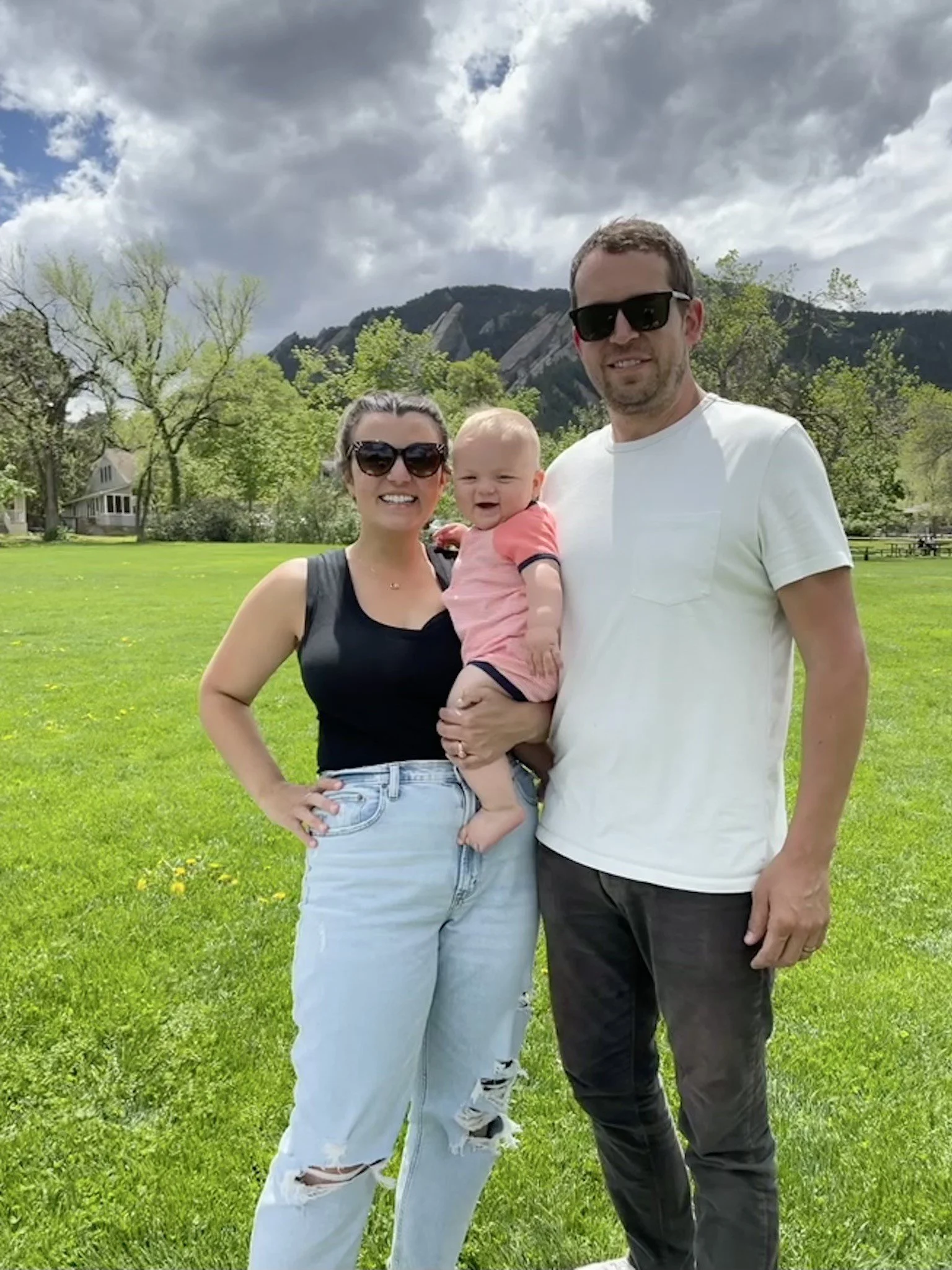 Chad and his wife and son standing outside