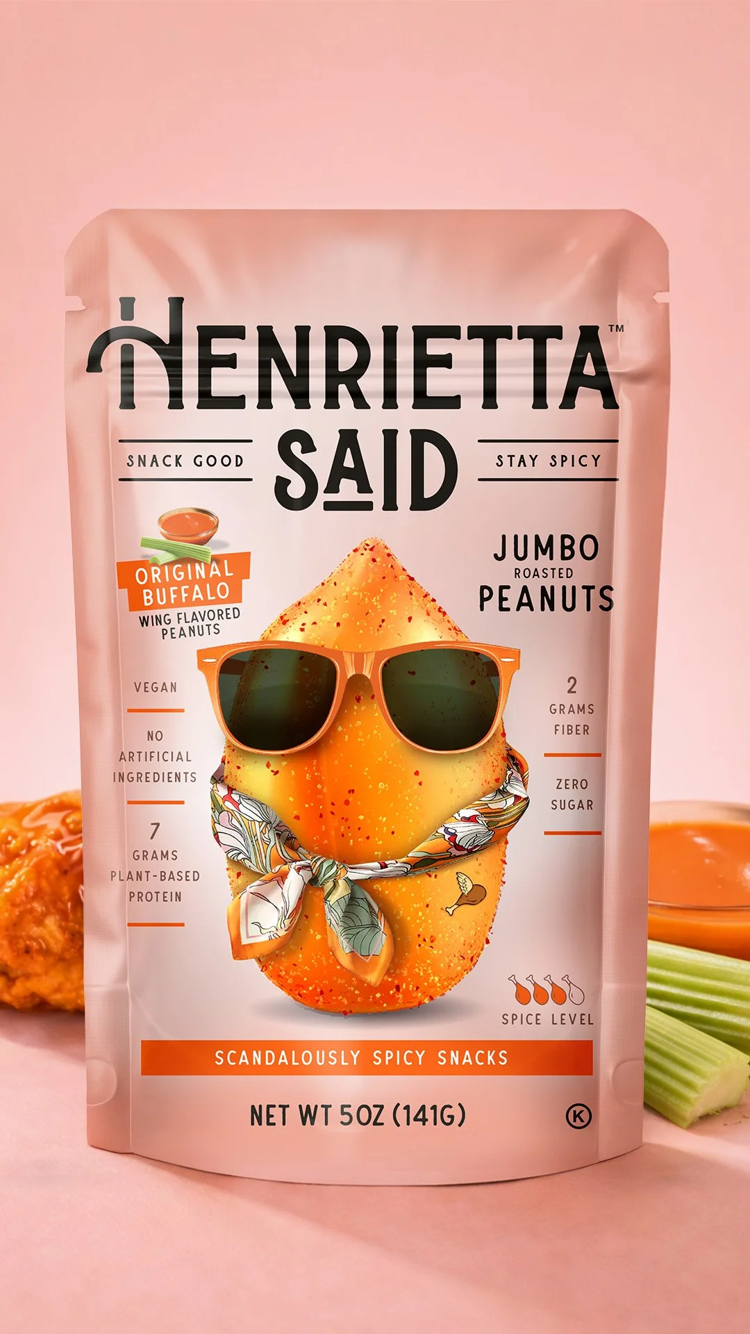 Package of Henrietta Said Jumbo Roasted Peanuts with a cartoon lemon wearing sunglasses and a bandana, set against a pink background with celery and other snacks.