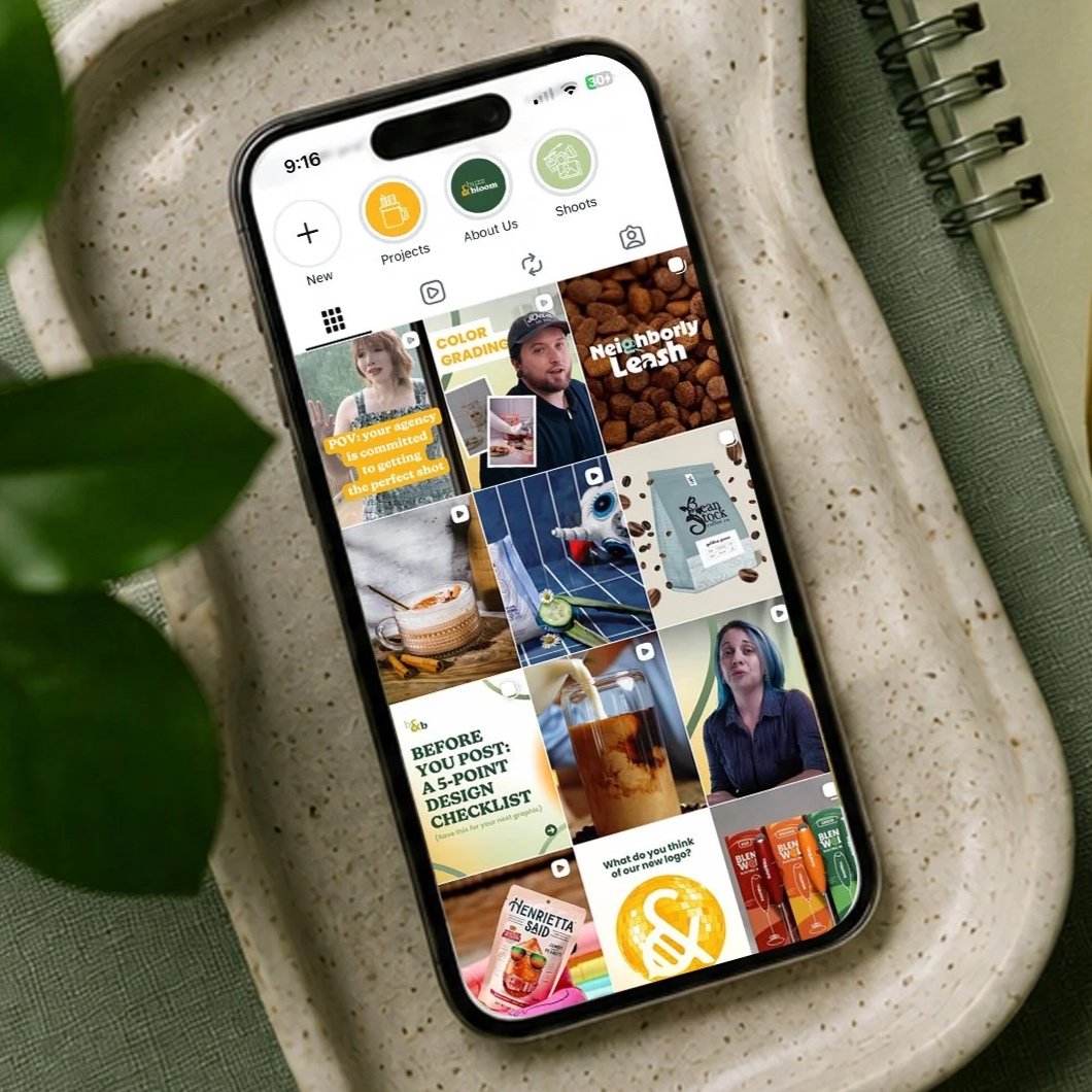A cellphone showing the Instagram social media feed of Buzz & Bloom Media lying in a ceramic dish 