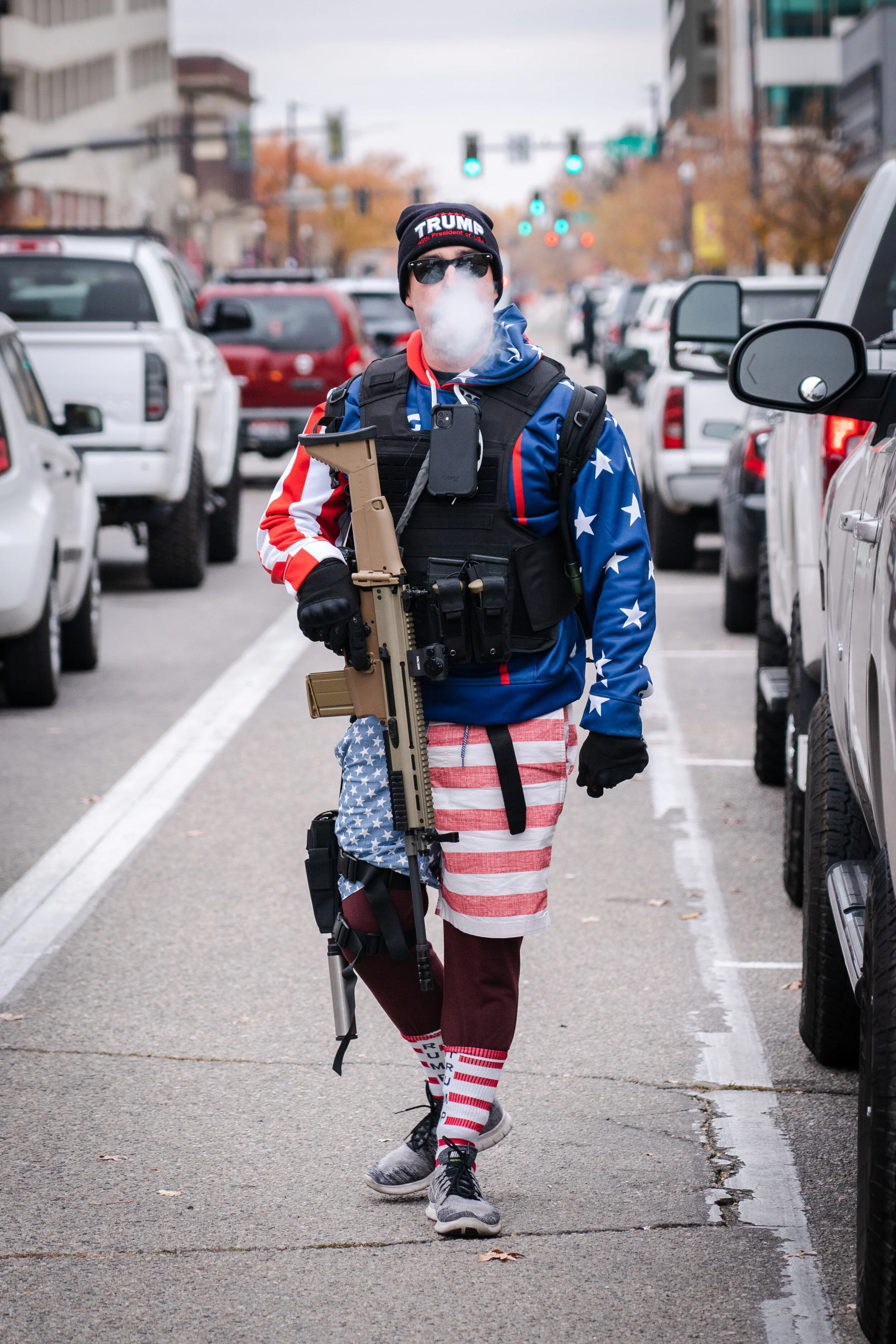 A man marches towards the Idaho Capitol to protest Joe Biden's victory of the 2020 election.