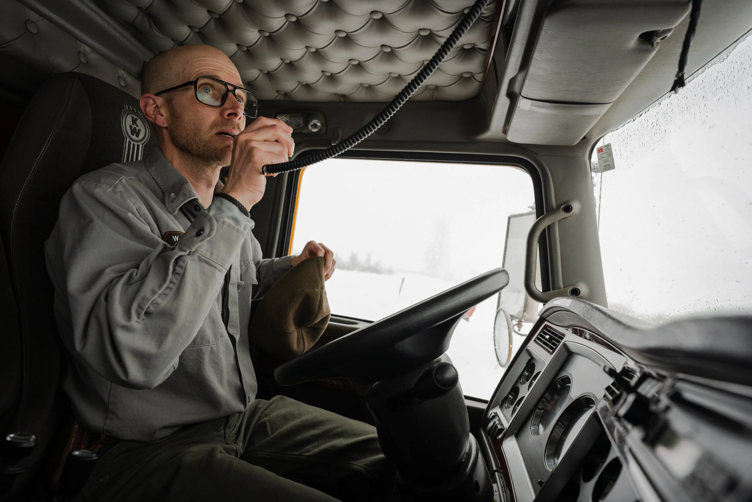 Grand Teton NPS snowplow driver Alex Roberts calls in his route during one of the largest snowfalls in Teton County's history. Shot for KHOL Community Radio.