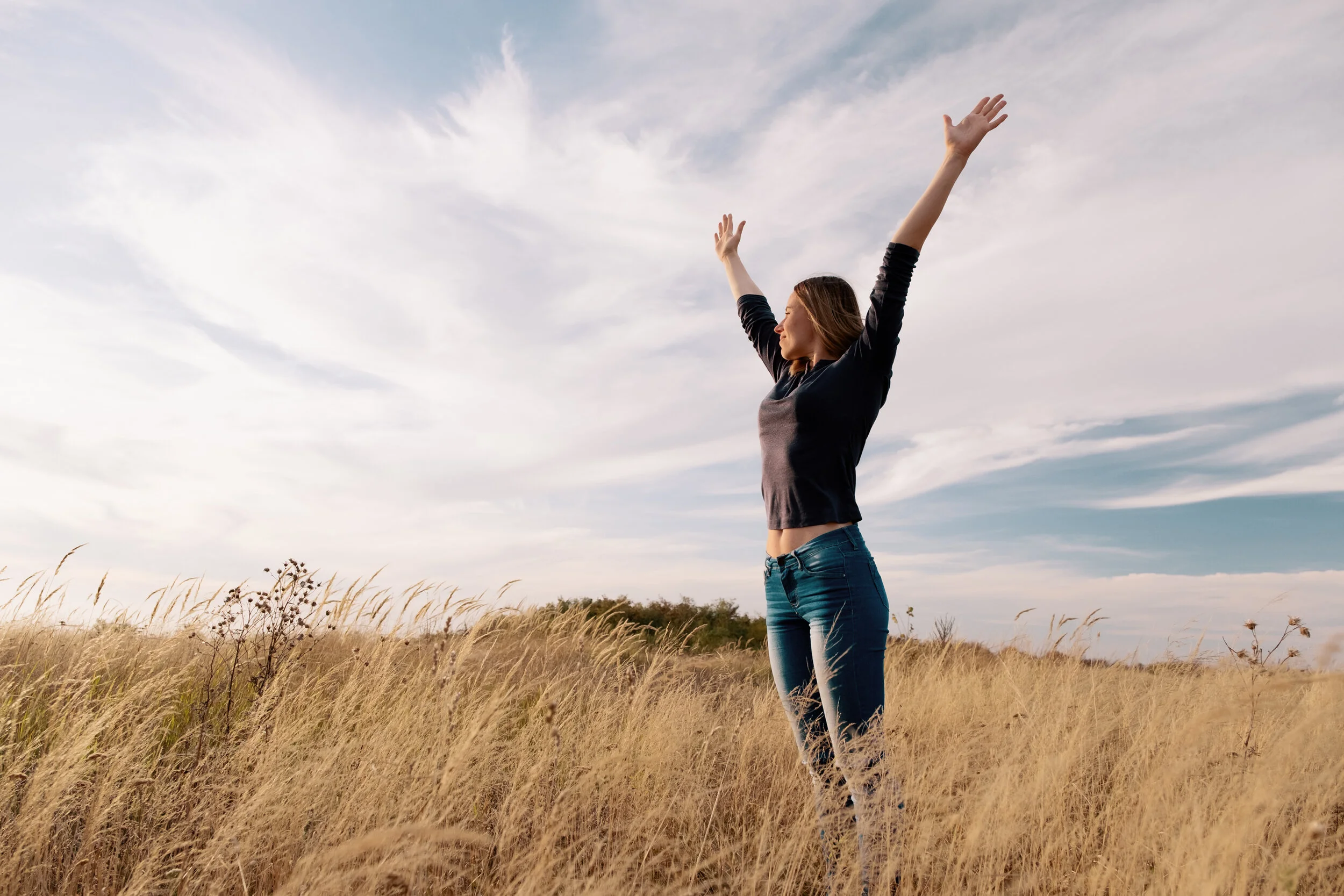young-happy-woman-in-golden-field-on-sunset.jpg