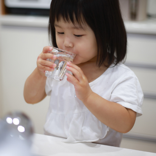 child drinking water for constiaption